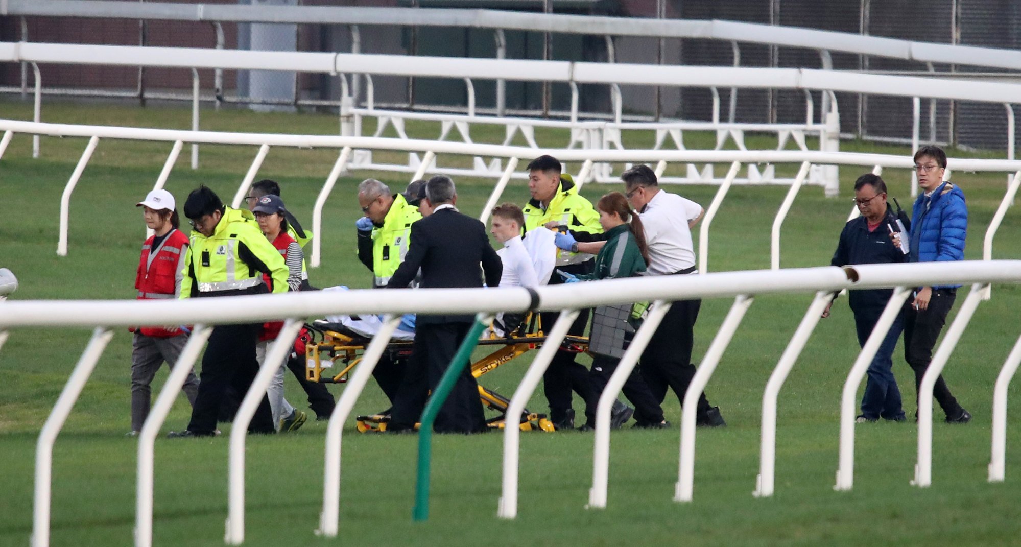 Jockey Lyle Hewitson is stretchered from the track.