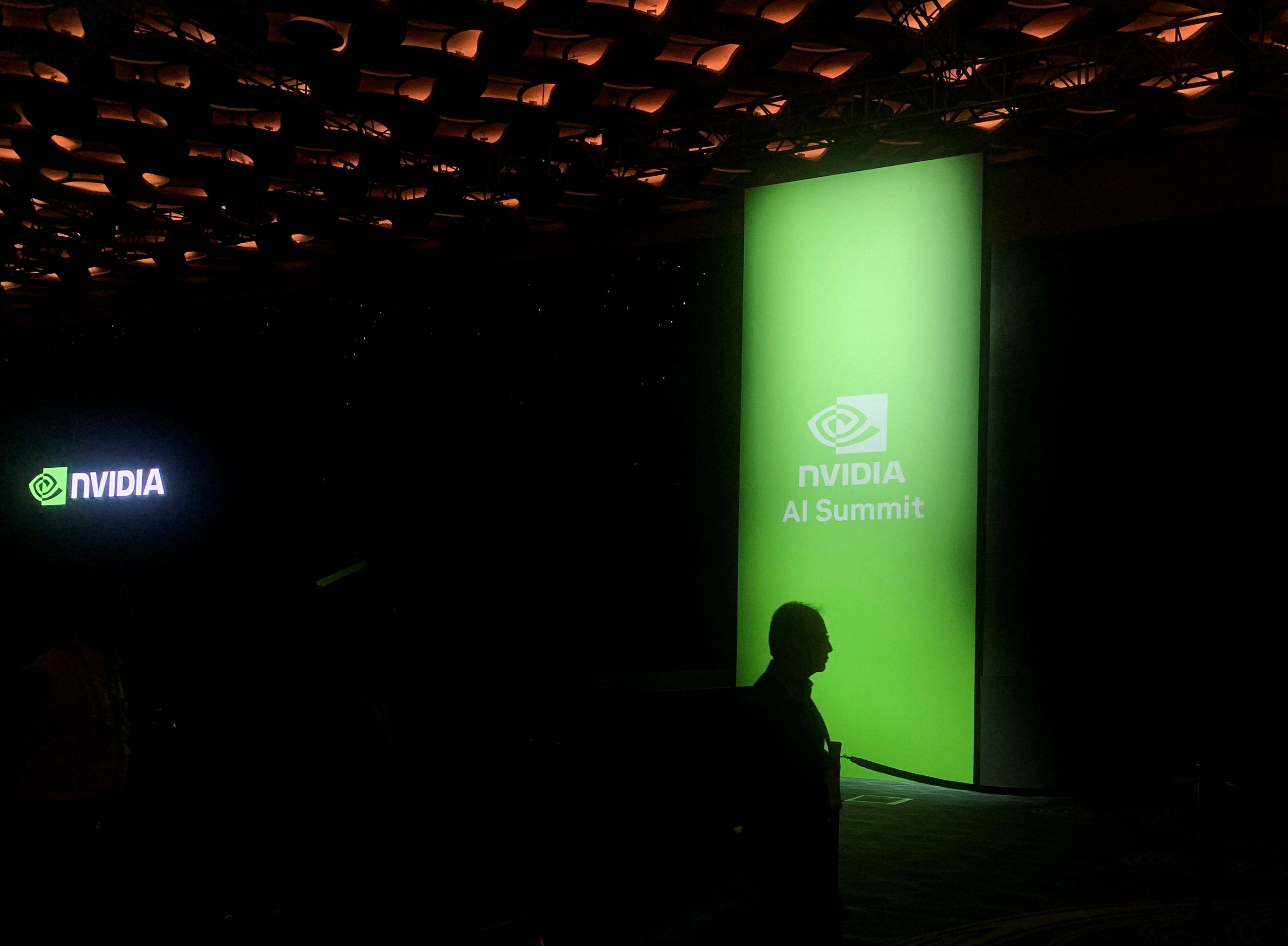 A man walks past the Nvidia logo at the company’s AI Summit in Mumbai, India, on October 24. Photo: Reuters