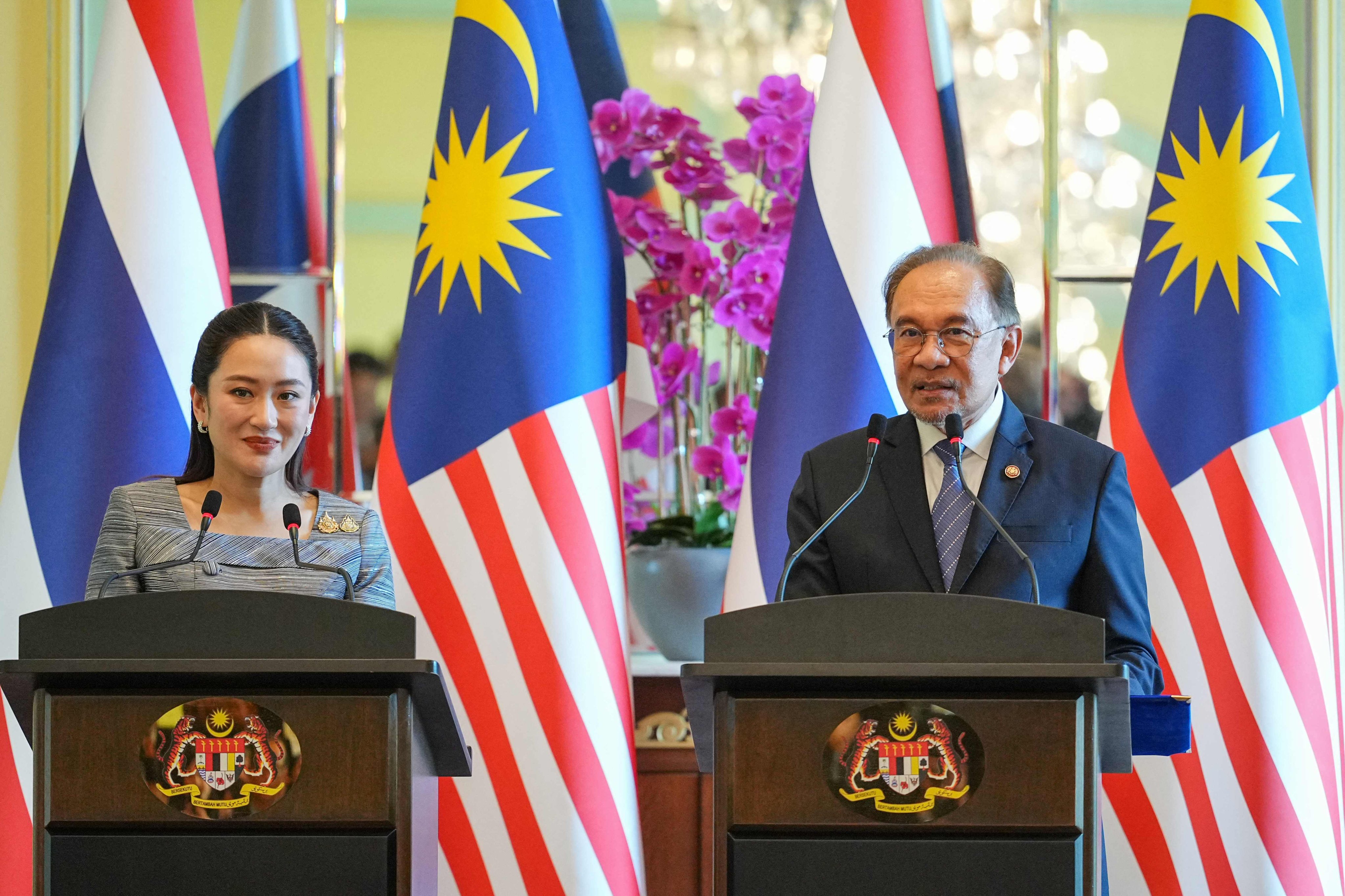 Malaysia’s Prime Minister Anwar Ibrahim and Thailand’s Prime Minister Paetongtarn Shinawatra speak in a joint press conference in Putrajaya on Monday. Photo: AFP