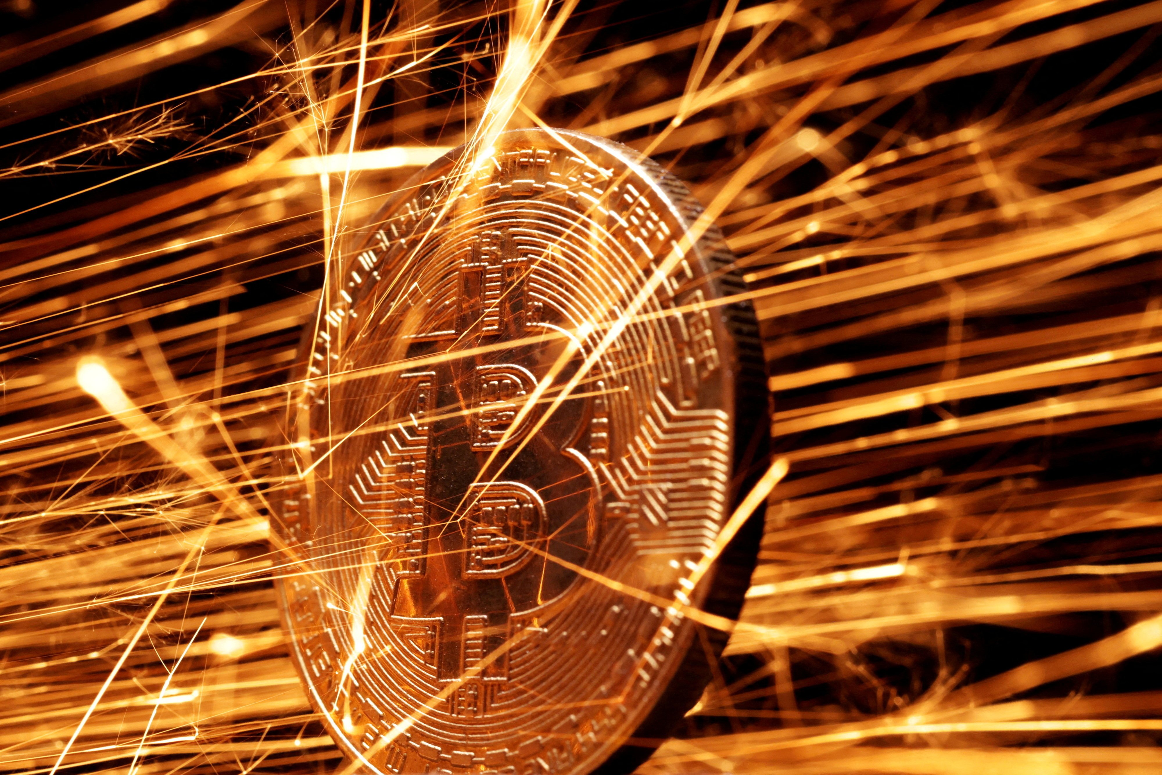 Sparks strike a representation of bitcoin in this illustration picture taken November 24, 2024. Photo: Reuters