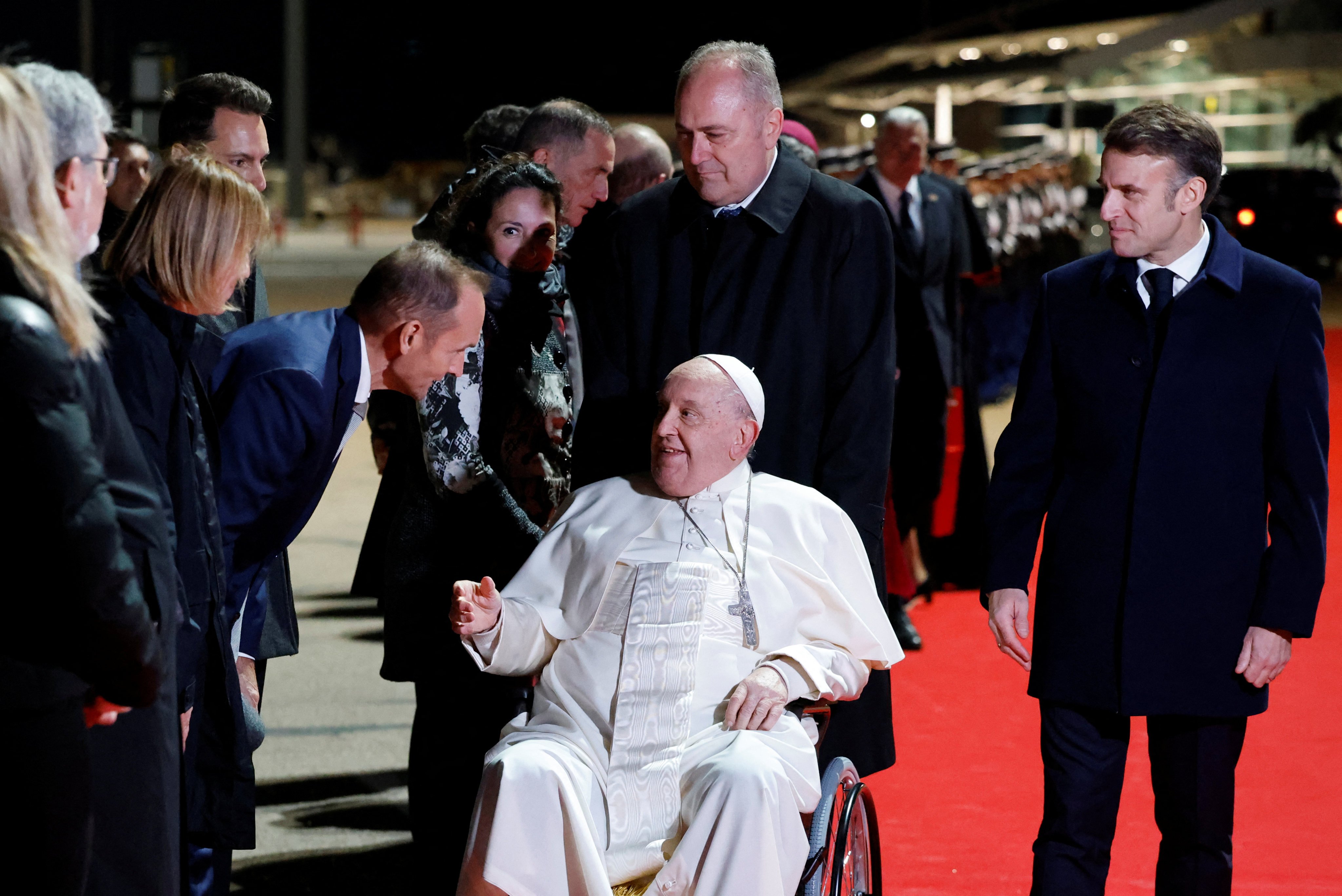 Pope Francis and French President Emmanuel Macron, right, attend the pope’s departure ceremony at Ajaccio airport on the French island of Corsica on Sunday. Photo: Pool via Reuters