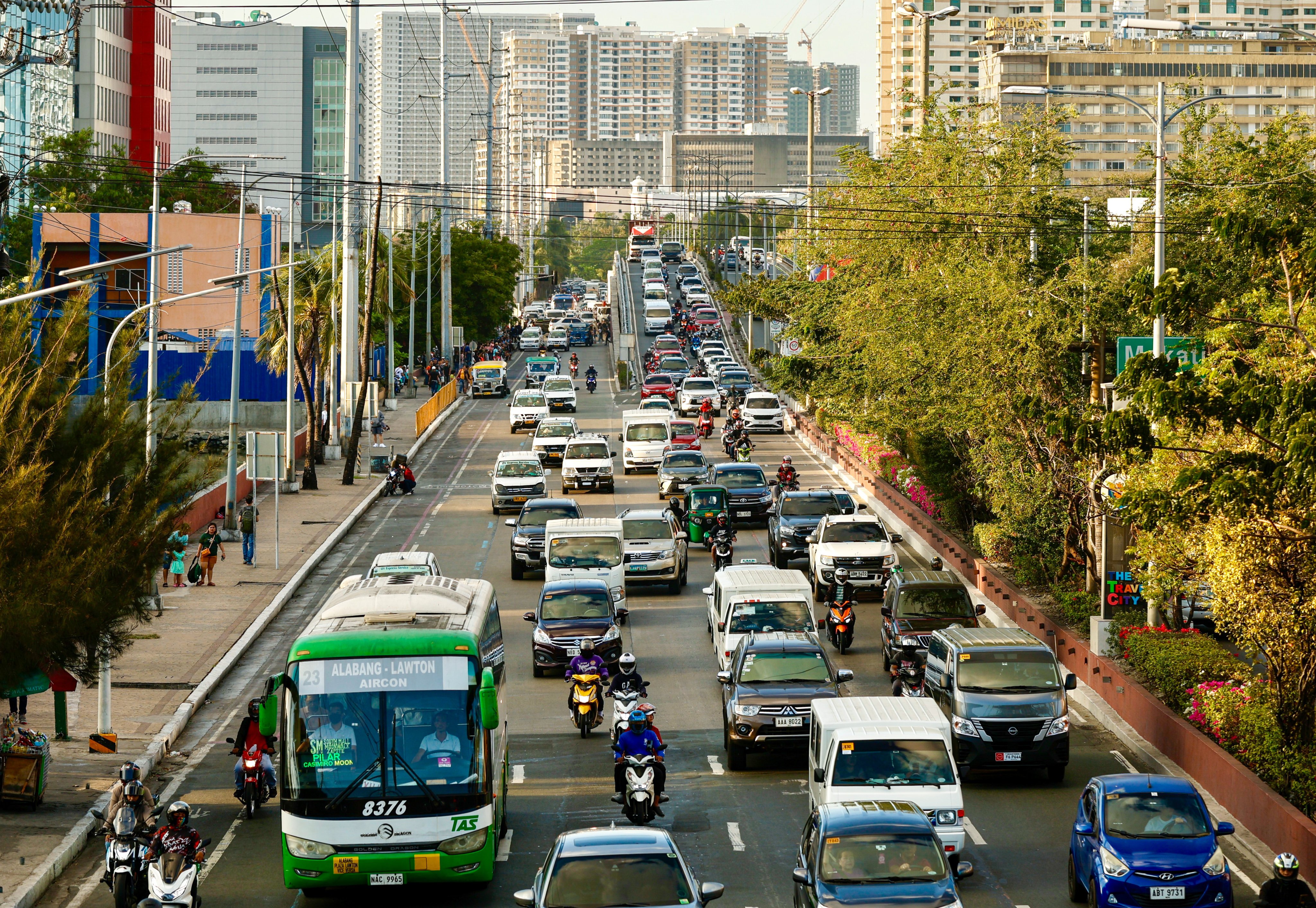 Vehicles travel a road in Metro Manila on February 28. China’s embassy in the Philippines has warned citizens to travel in groups, avoid high-risk areas and remain vigilant in crowds amid a crime surge. Photo: EPA-EFE