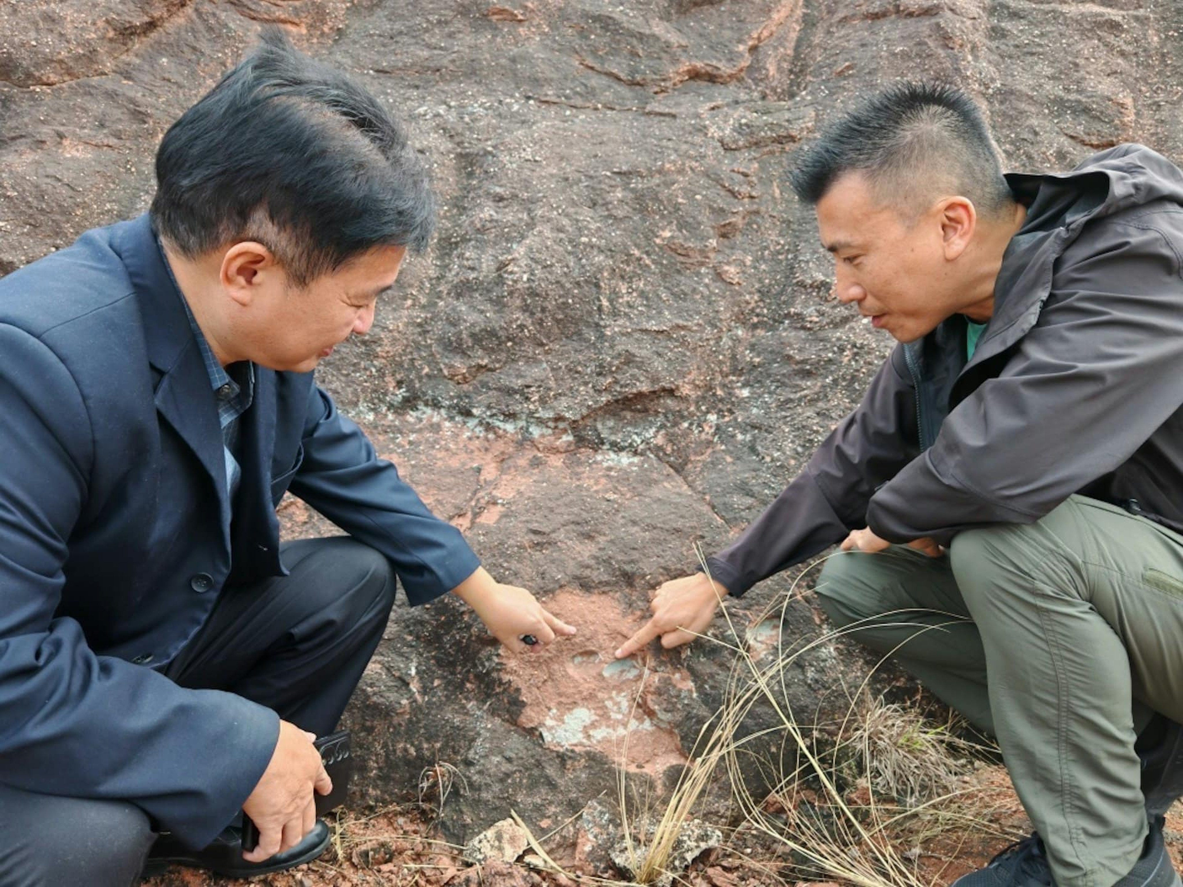 Erik Yip (right) points to the discovery in  Heyuan city. Photo: Guangzhou Daily