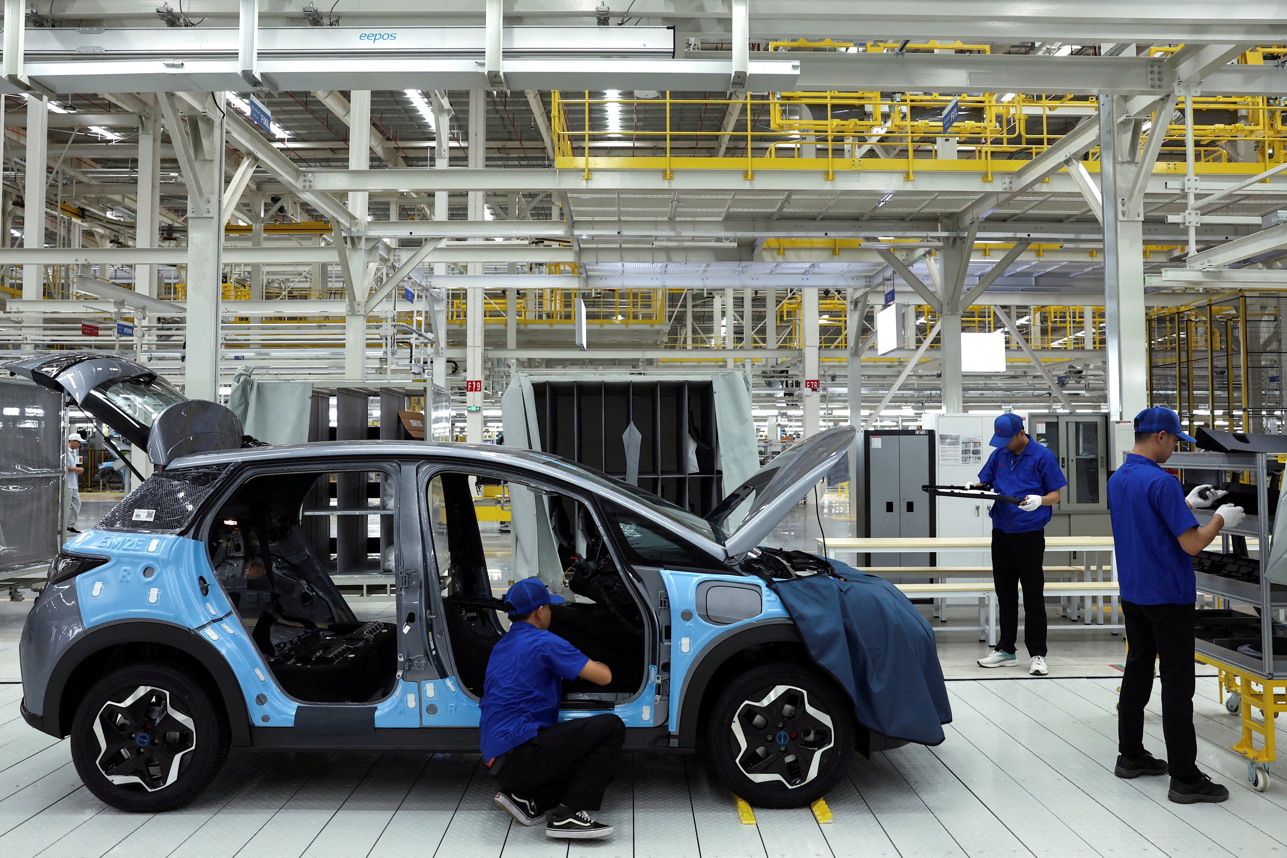 Workers assemble an EV inside BYD’s first EV factory in Southeast Asia, in Rayong, Thailand, on July 4, 2024. Photo: Reuters