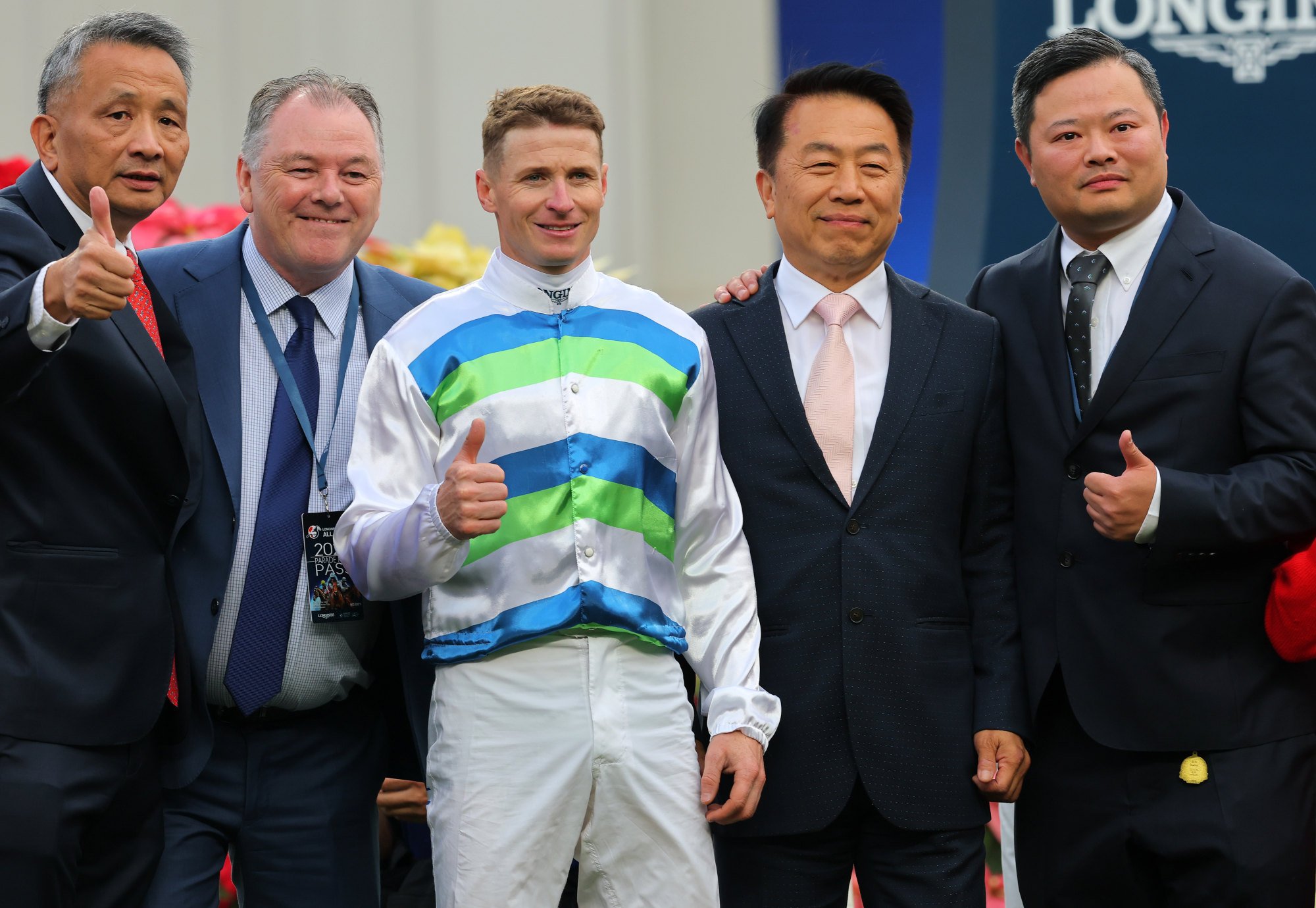 Jockey James McDonald, trainer Ricky Yiu (second from right) and connections of Voyage Bubble after his Hong Kong Mile victory.