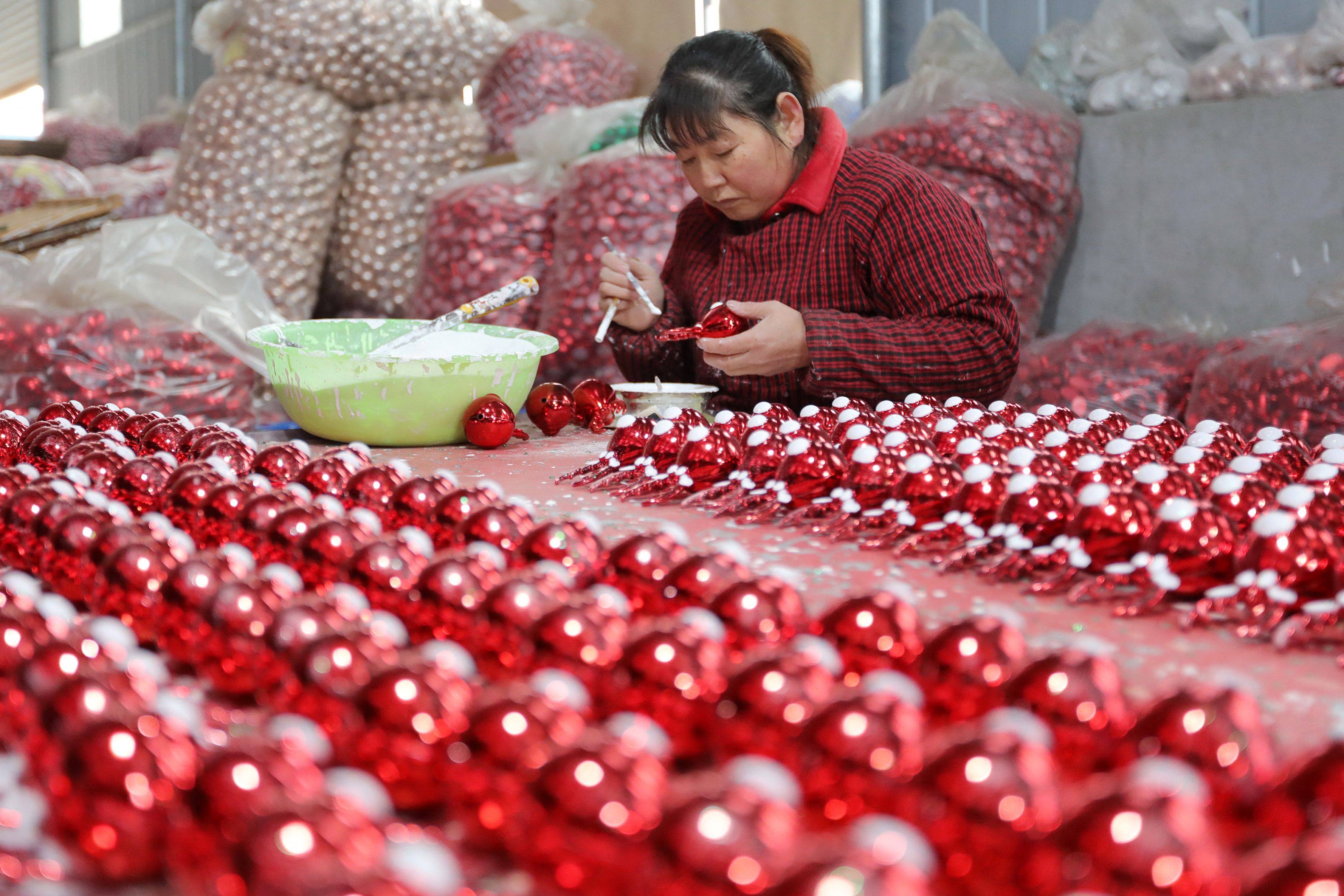 A worker makes Christmas decorations at a workshop in Huaibei in China’s eastern Anhui province. Photo: AFP