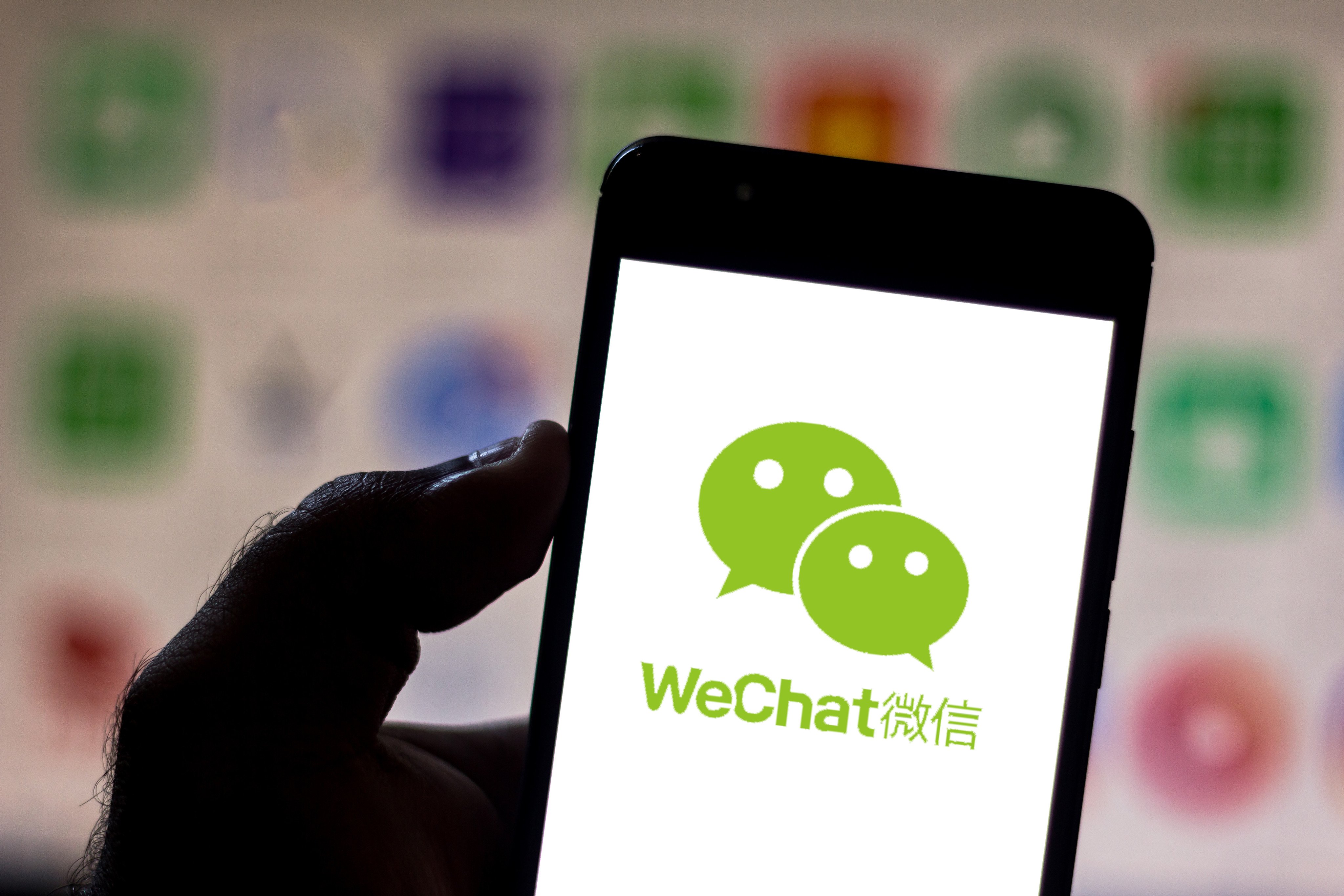 The WeChat logo is displayed on a smartphone screen. Photo: Shutterstock Images