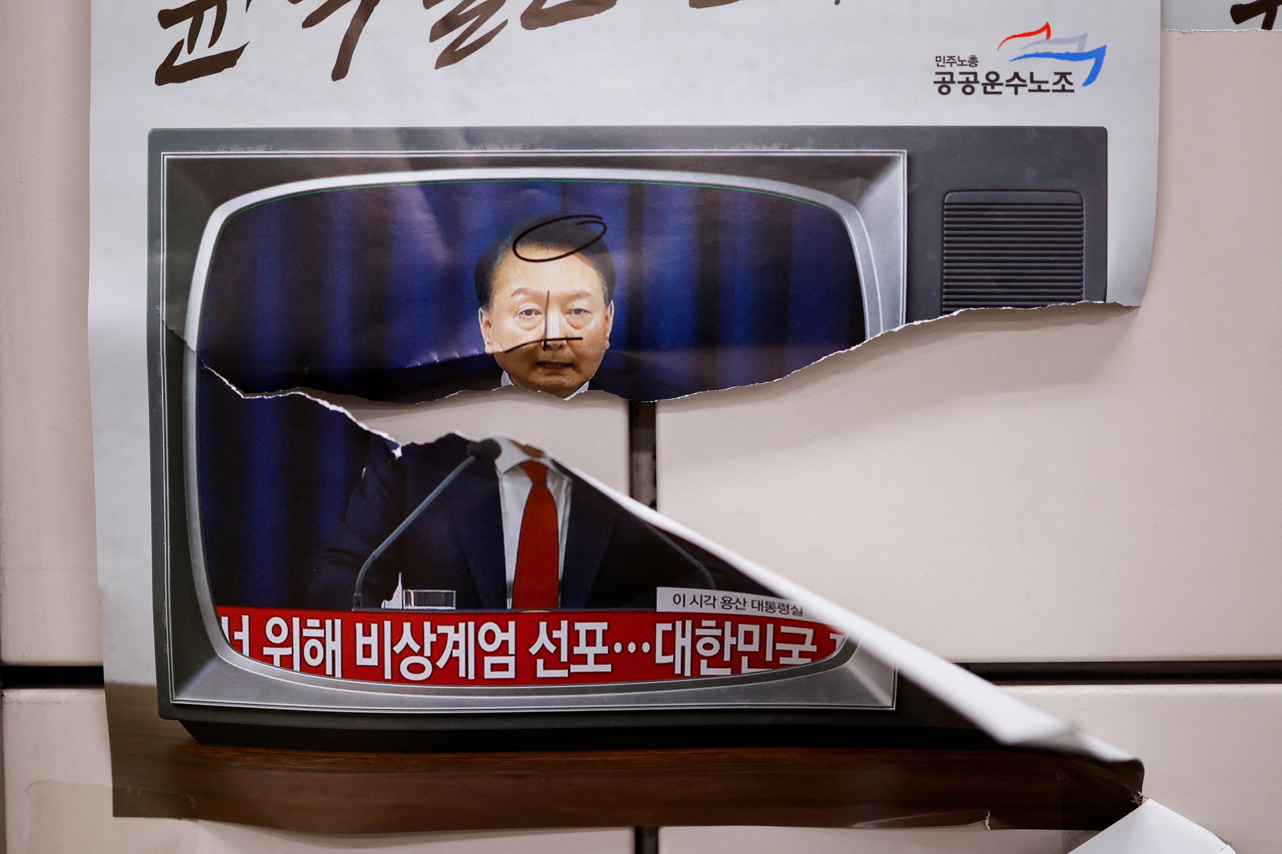 A torn poster featuring the image of South Korean President Yoon Suk-yeol is seen in Seoul earlier this month. Photo: Reuters