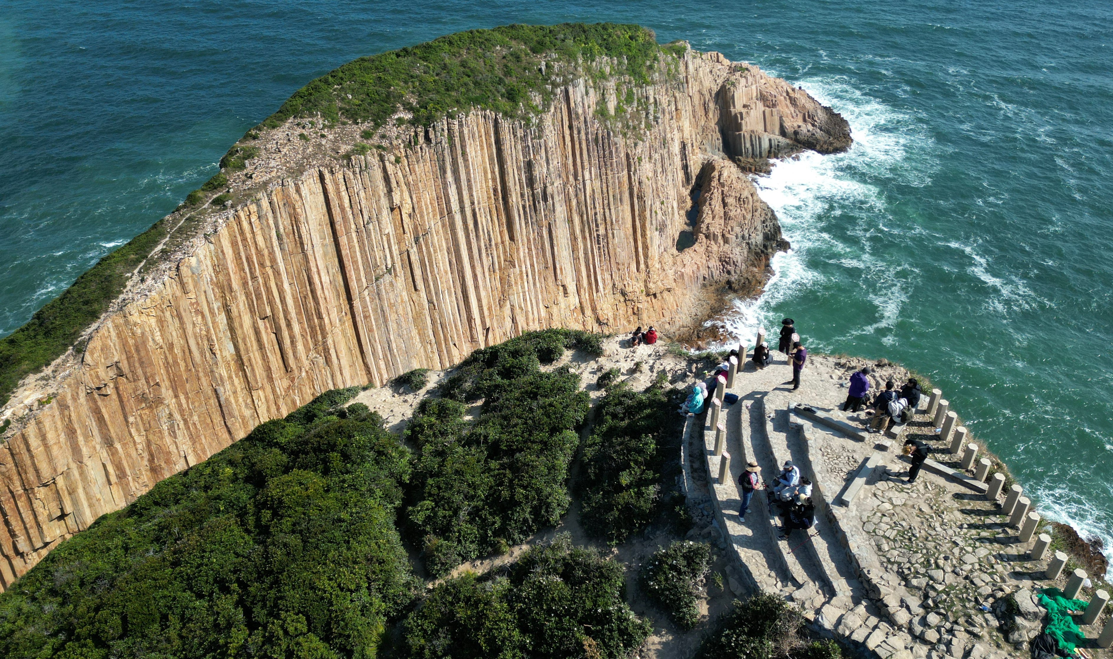 Visitors enjoy the views of Po Pin Chau – an islet known for its spectacular sea stacks and which is part of the Global Geopark. Photo: Sam Tsang