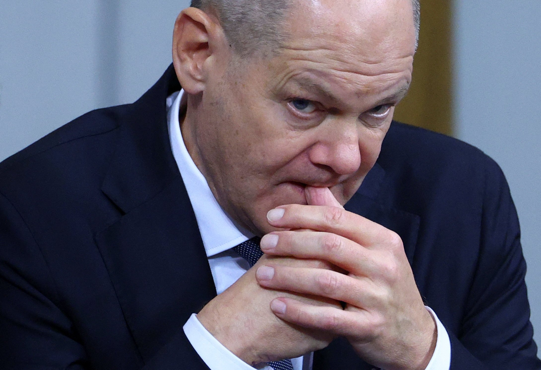 German Chancellor Olaf Scholz bites his finger, on the day of a confidence vote called by him to pave way for snap election. Photo: Reuters