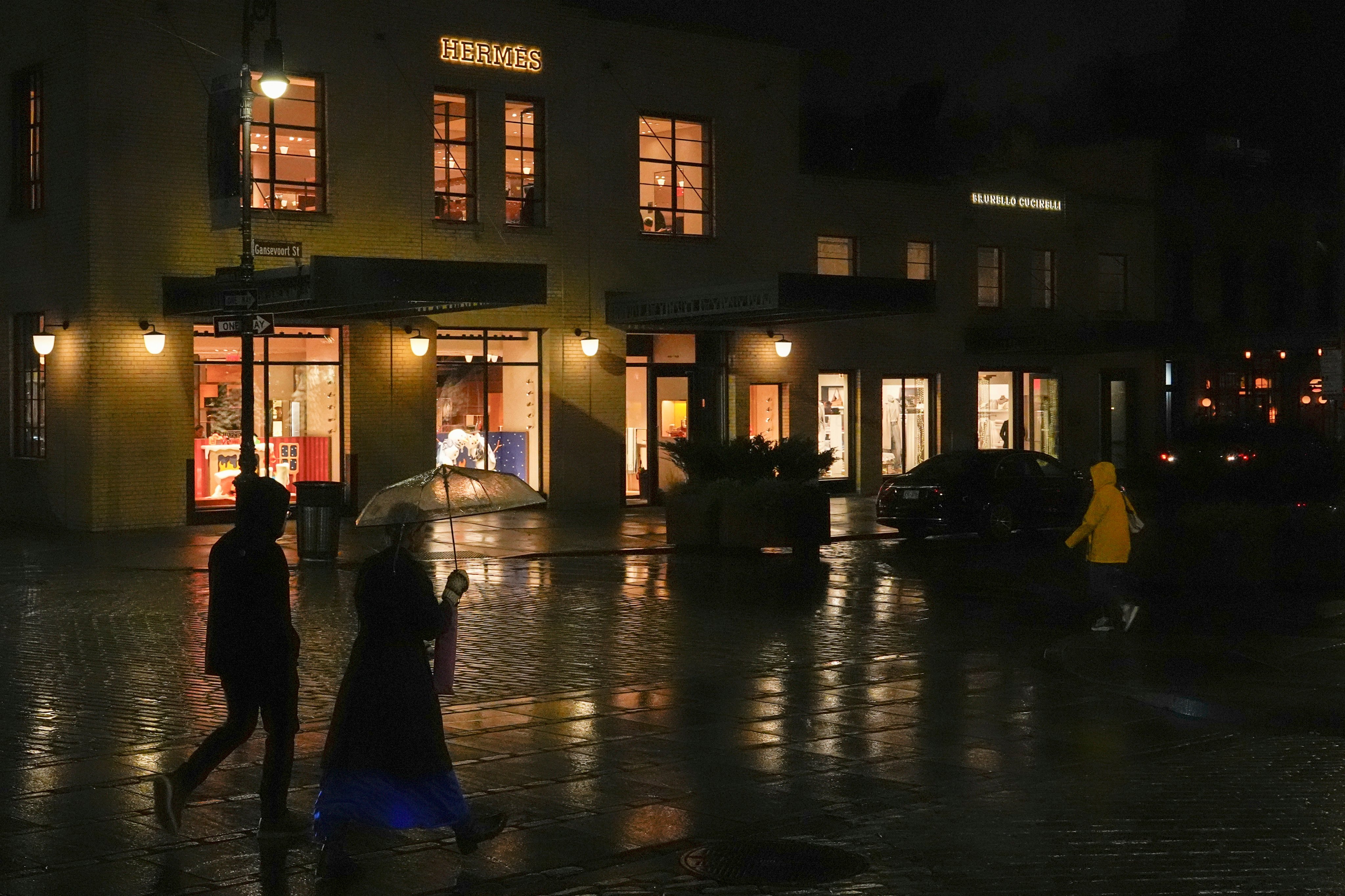 People passed a Hermes store in New York. Photo: AP 