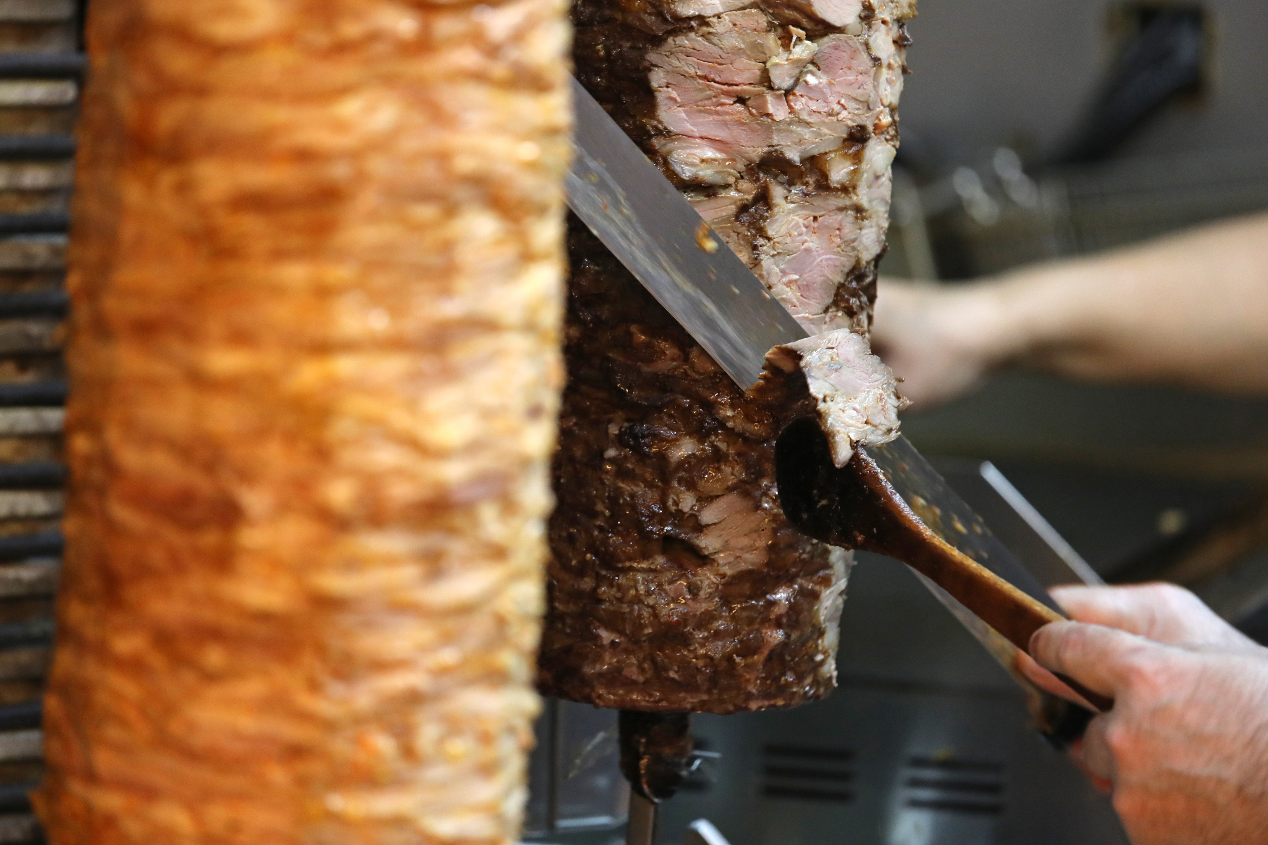 The chef of New Istanbul Kebab on Hart Avenue, Tsim Sha Tsui, cuts lamb to make a kebab. Photo: Bruce Yan