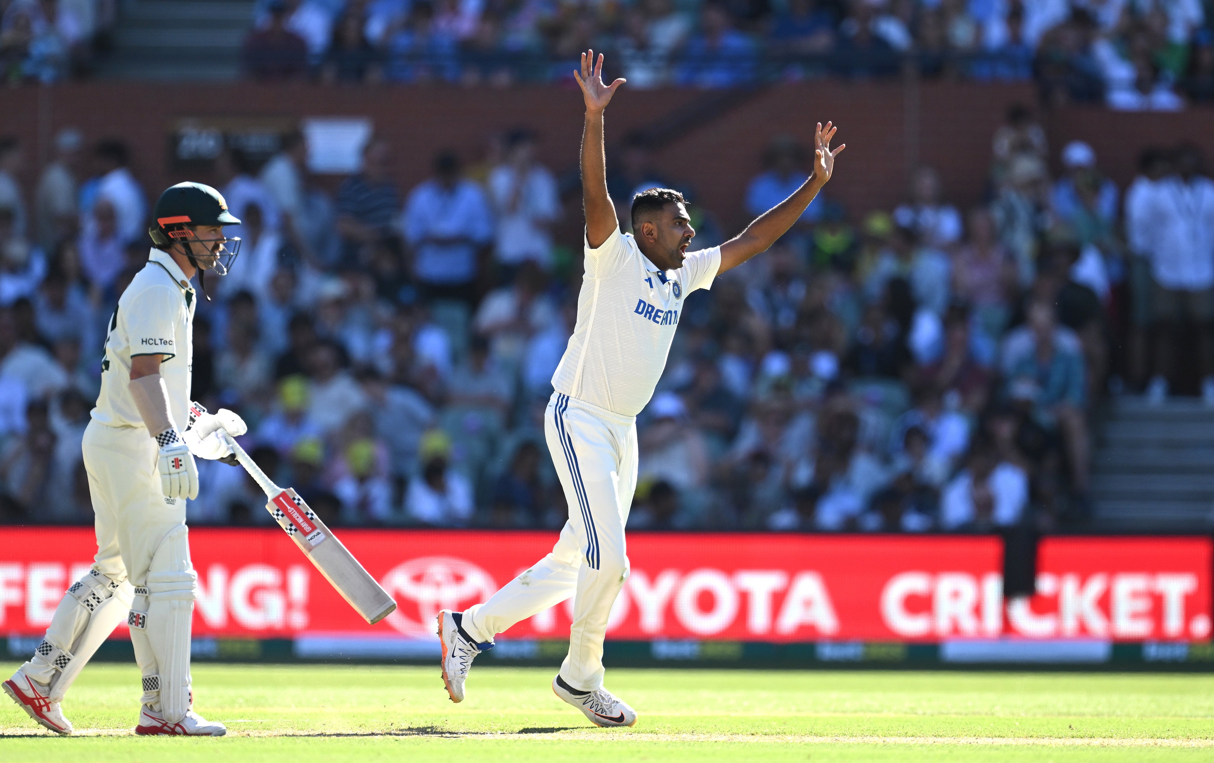 India’s Ravichandran Ashwin (right) dismisses Australia’s Mitchell Marsh in the second Test in Adelaide, his final international match. He took more wickets against Australia than any other country. Photo: EPA-EFE 