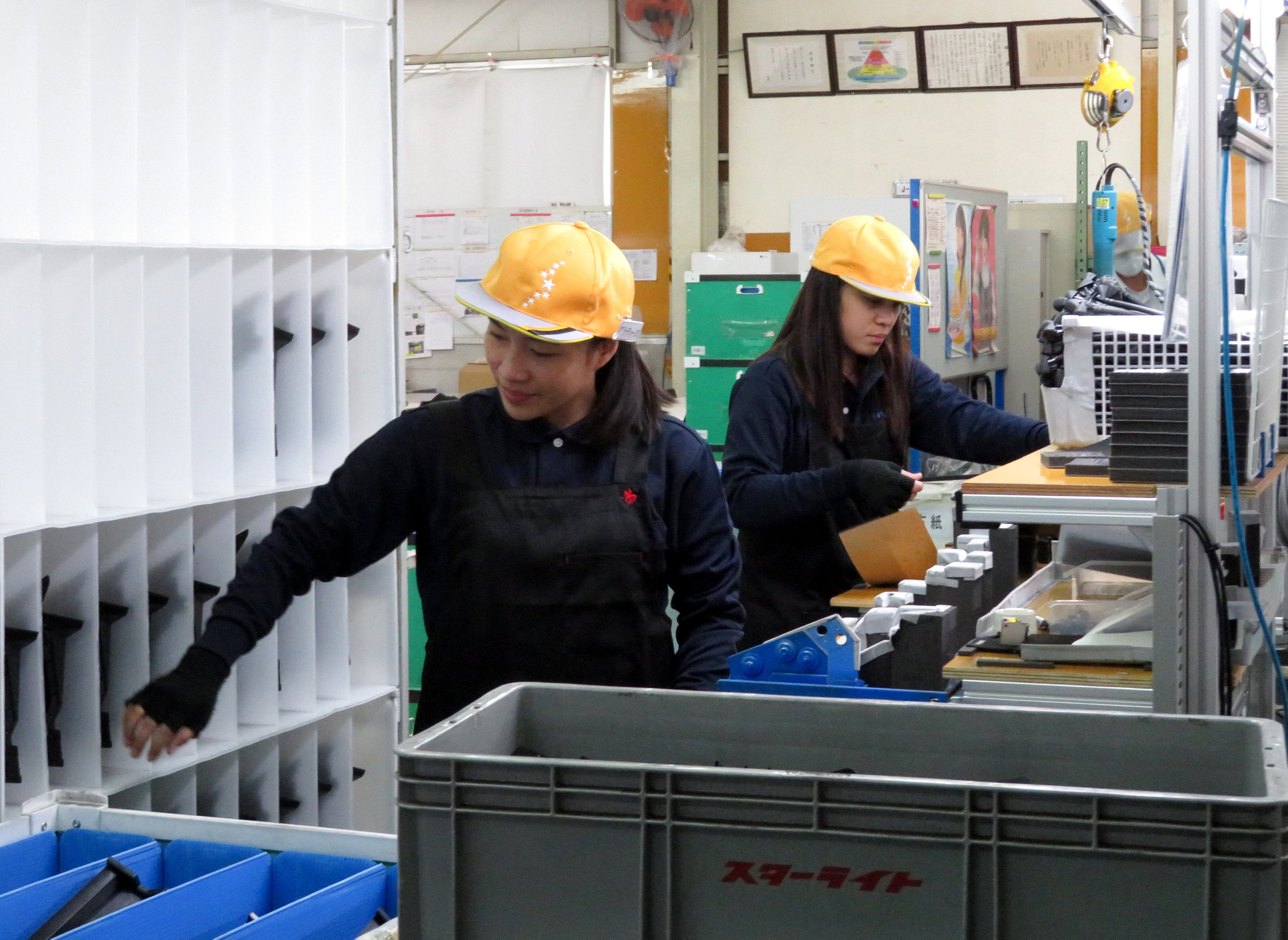 Foreign trainees work at a car parts factory in Hiroshima prefecture, western Japan. The Japanese government has pledged to scrap the technical internship training programme by 2027. Photo: Reuters