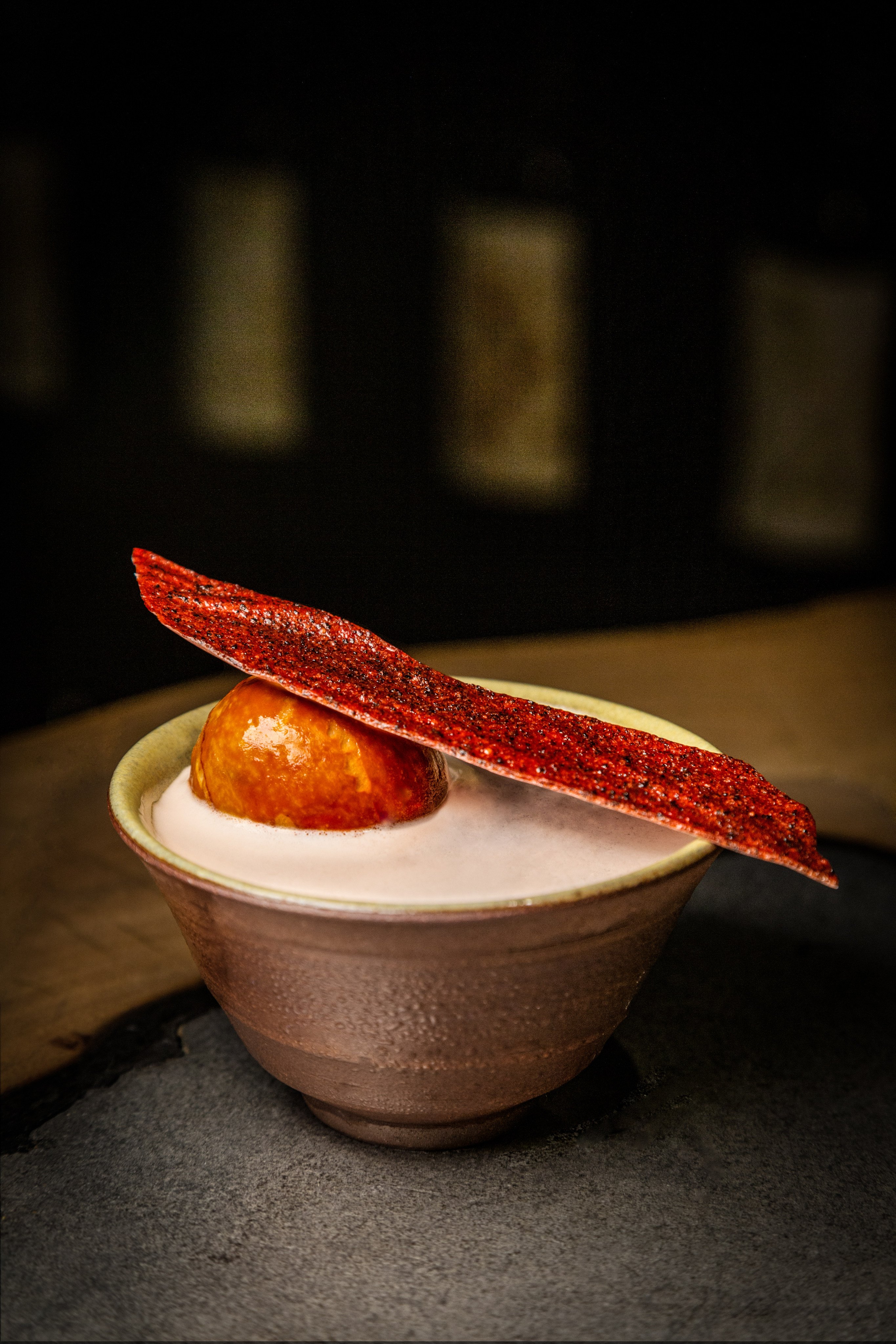 Penicillin bar’s delicious One Penicillin, One Tree whisky cocktail is infused with waste white chocolate, and garnished with an edible “leather” made from leftover papaya seeds and strawberries. Photo: Handout