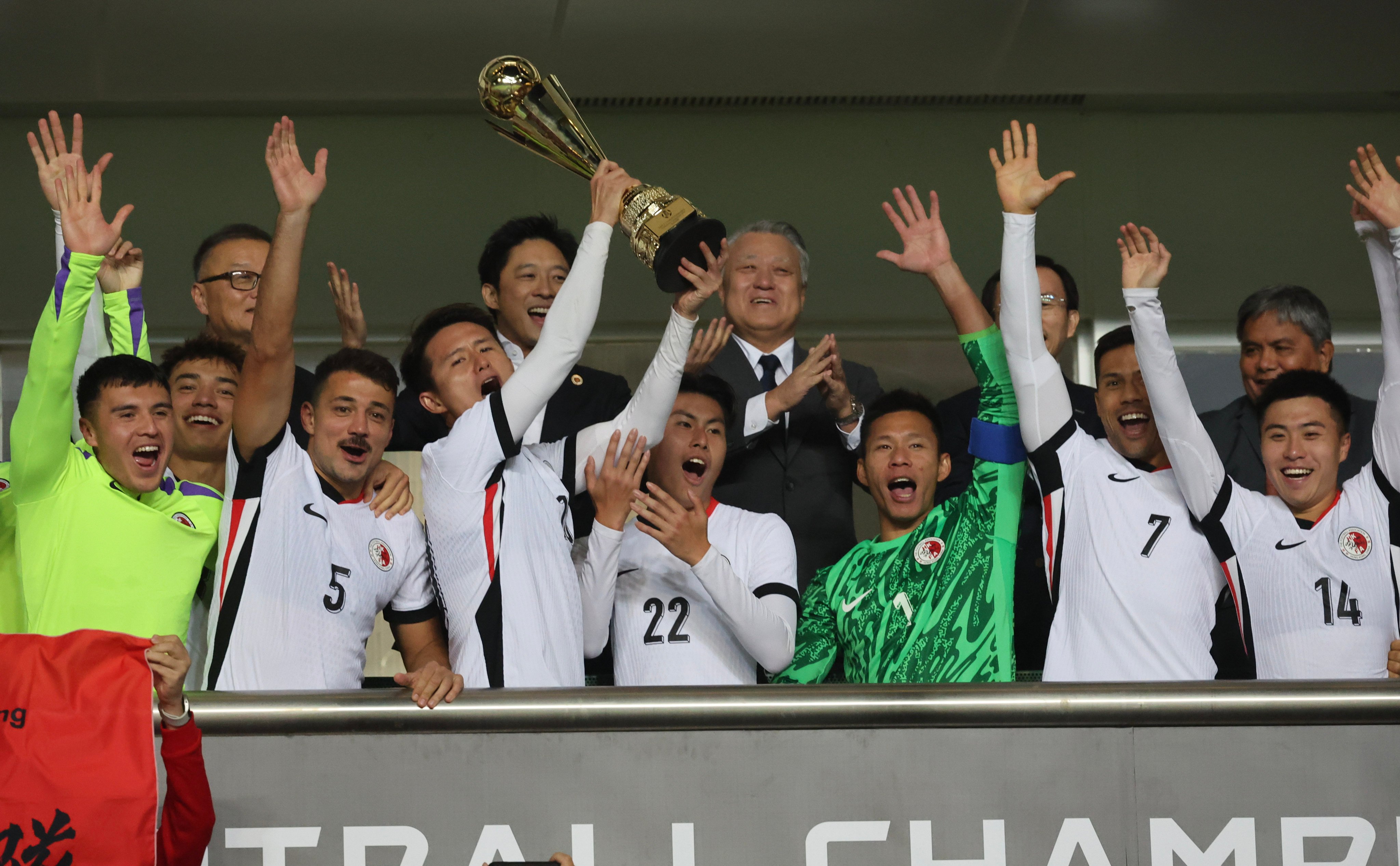 Hong Kong’s players celebrate reaching next year’s EAFF finals in South Korea. Photo: Dickson Lee