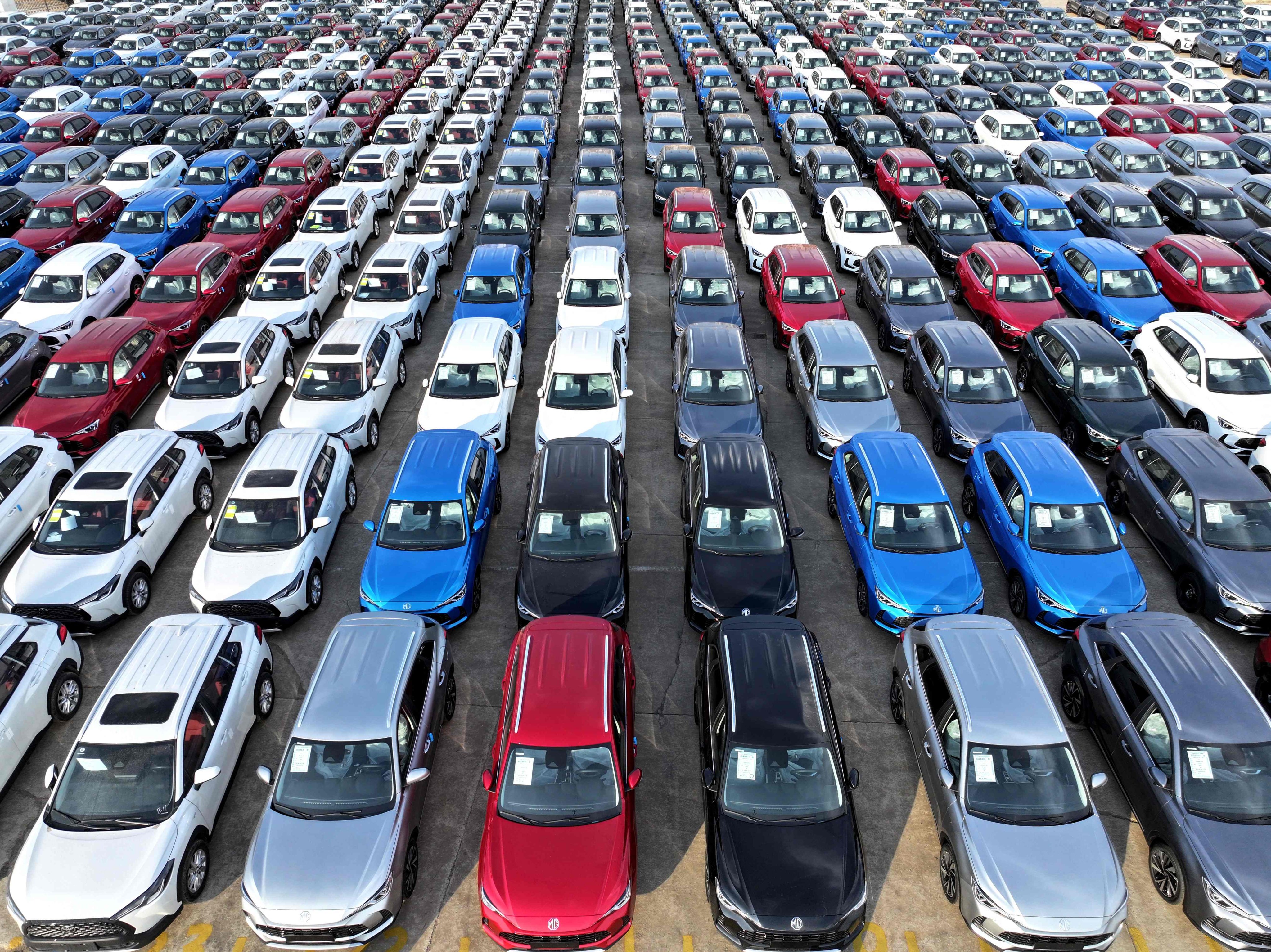 Cars wait to be loaded onto ships for export at a port in China’s Jiangsu province on Thursday. EV tariff talks between China and the EU are “not close” to yielding a deal. Photo: AFP