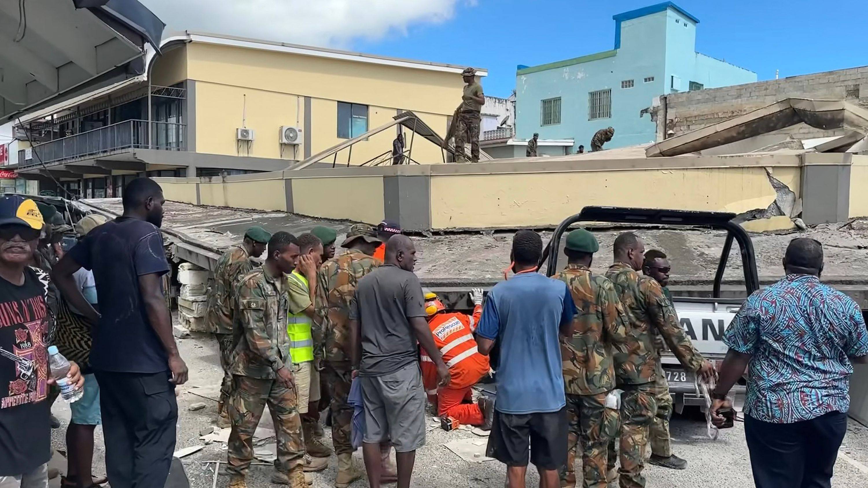 Rescuers inspect a collapsed building in Vanuatu’s capital Port Vila after a powerful earthquake hit the Pacific nation. Photo: Michael Thompson via AFP