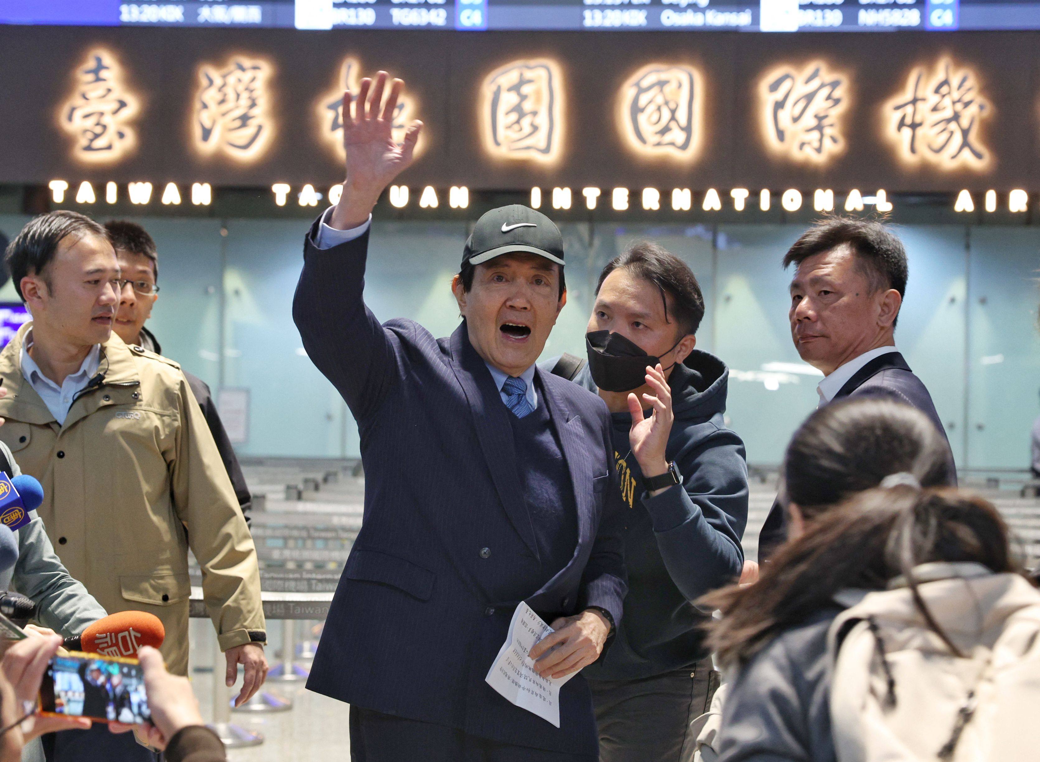 Former Taiwanese leader Ma Ying-jeou waves to the media at Taoyuan International Airport before travelling to Harbin on Wednesday. Photo: AFP