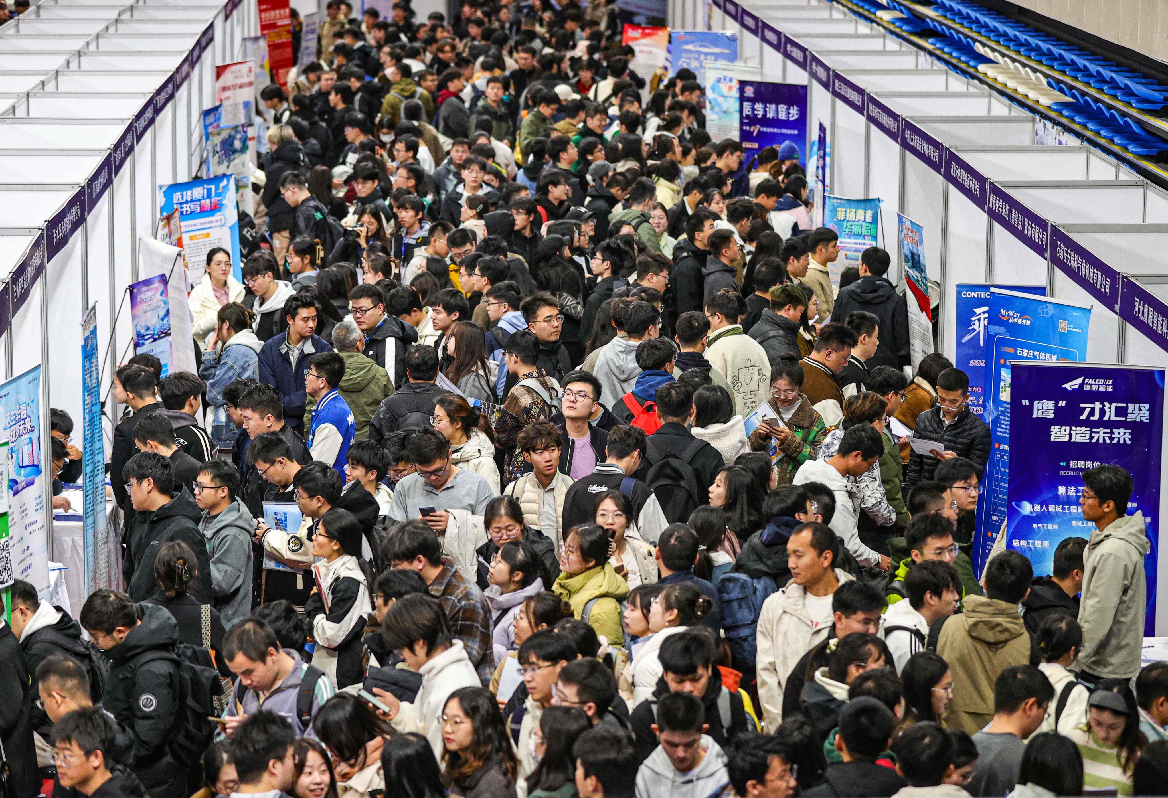 People attend a job fair in the northeastern Chinese city of Shenyang in October. Photo: AFP