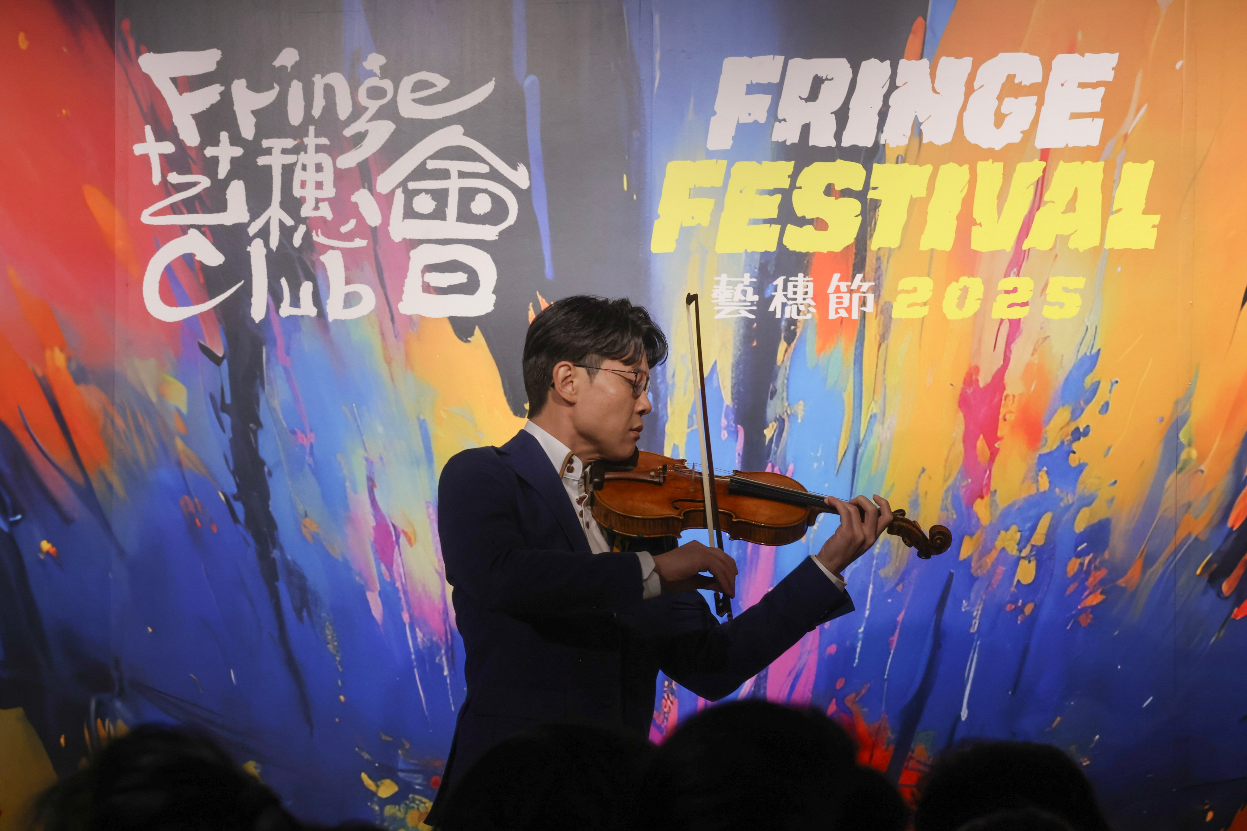 Violinist Anders Hui performs at a news conference to announce the Fringe Festival 2025. Photo; Jonathan Wong