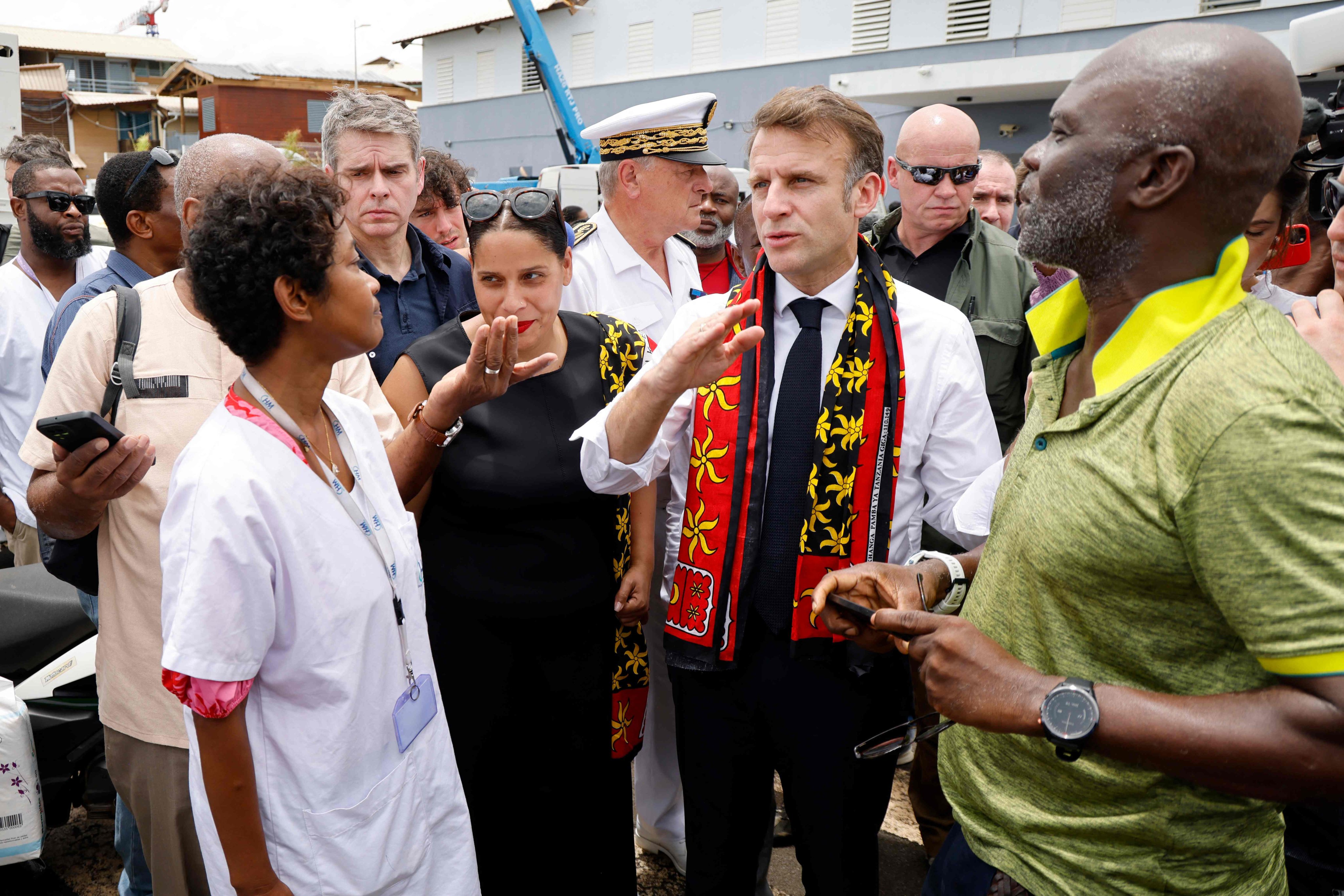 France’s President Emmanuel Macron with staff members and local elected representatives at the Mayotte Hospital Centre in Mamoudzou. Photo: AFP