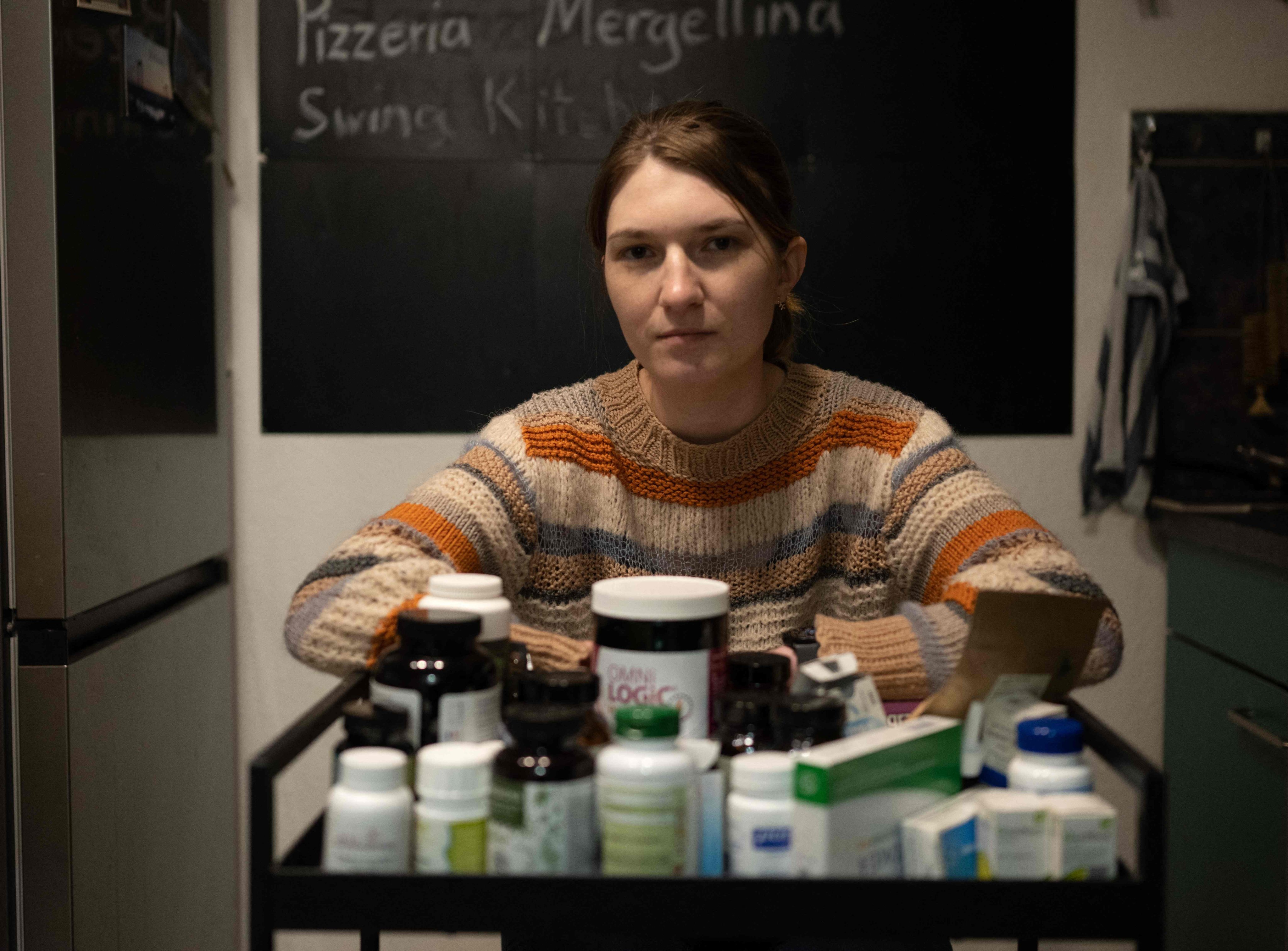 Andrea Vanek in Vienna, Austria, with medicine she takes for long Covid, a condition in which patients fail to recover fully from the acute phase of Covid infection. Photo: AFP