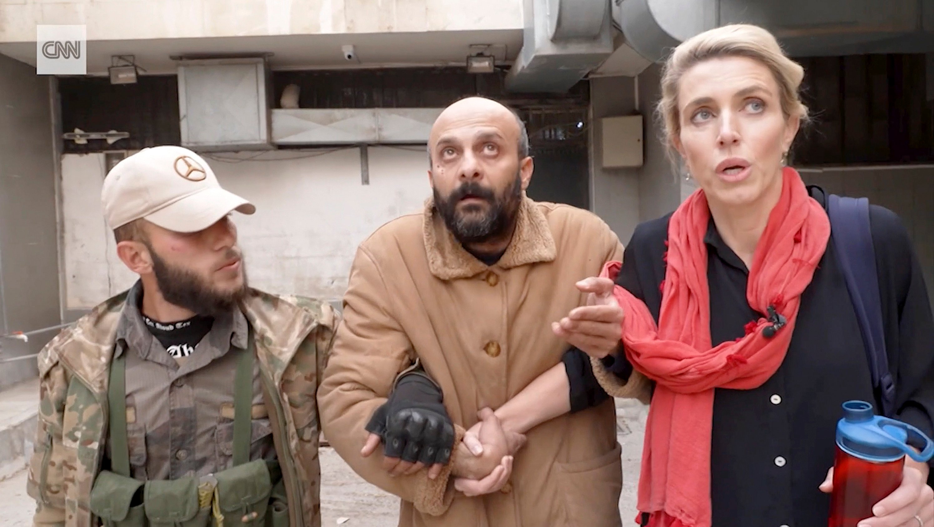 Reporter Clarissa Ward and a man who was freed after she and a Syrian rebel guard discovered him locked in a Damascus prison. Photo: CNN via AP