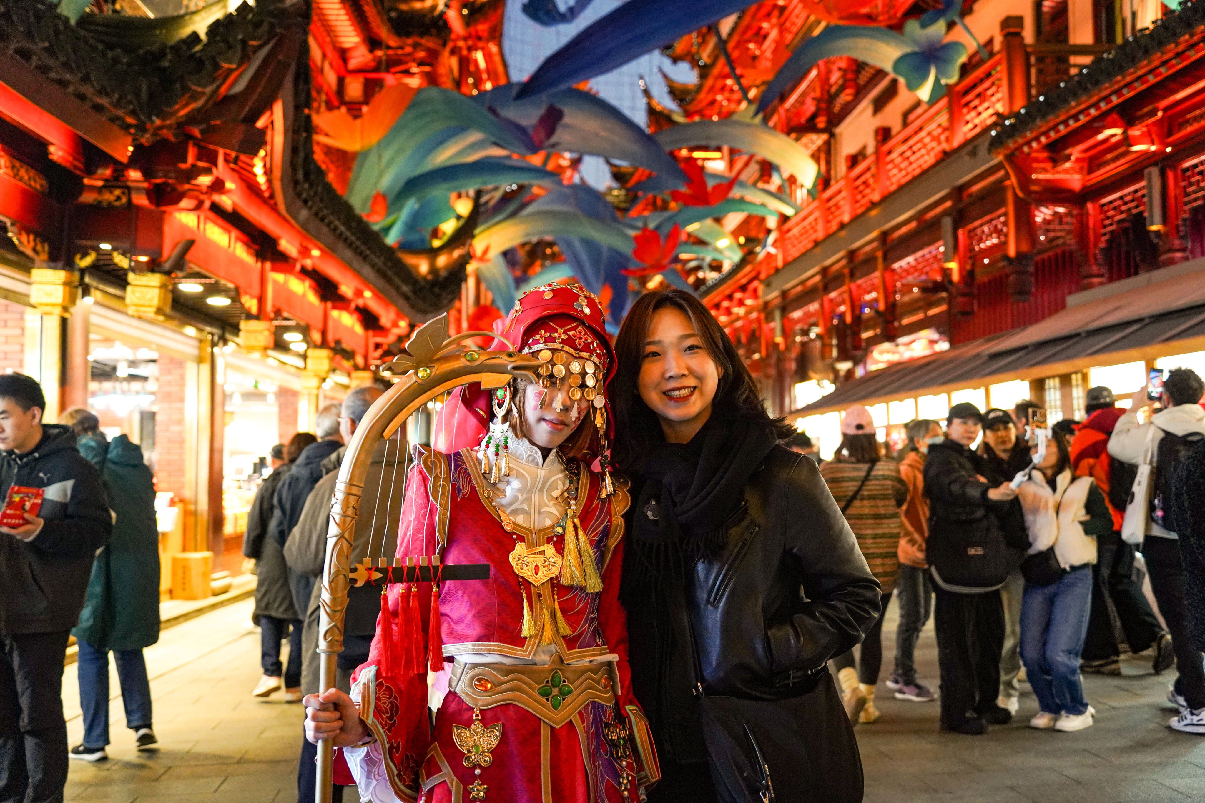 A tourist from South Korea visits the Yuyuan Garden Mall in Shanghai on November 30. Photo: Xinhua