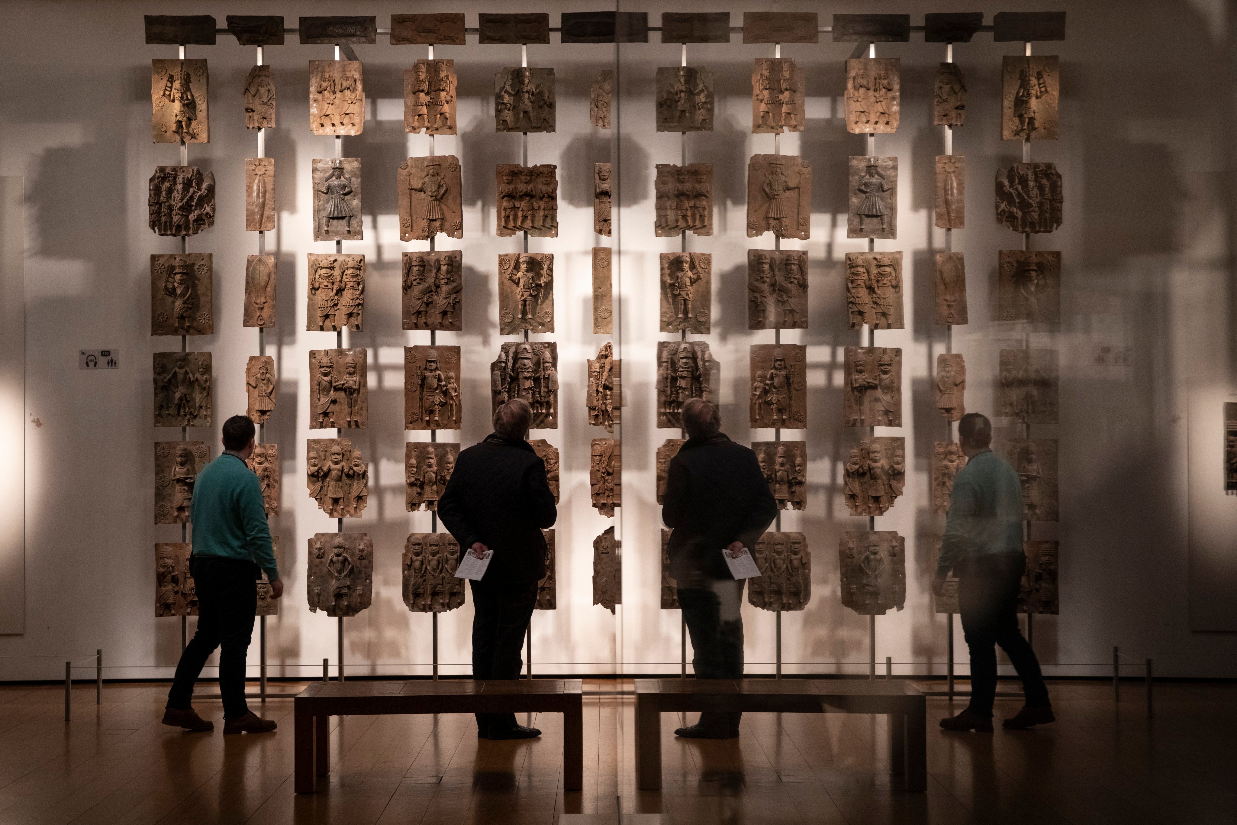 Plaques that form part of the Benin Bronzes, which were taken from Africa by British troops in 1897, on display at The British Museum in London. Photo: Getty Images