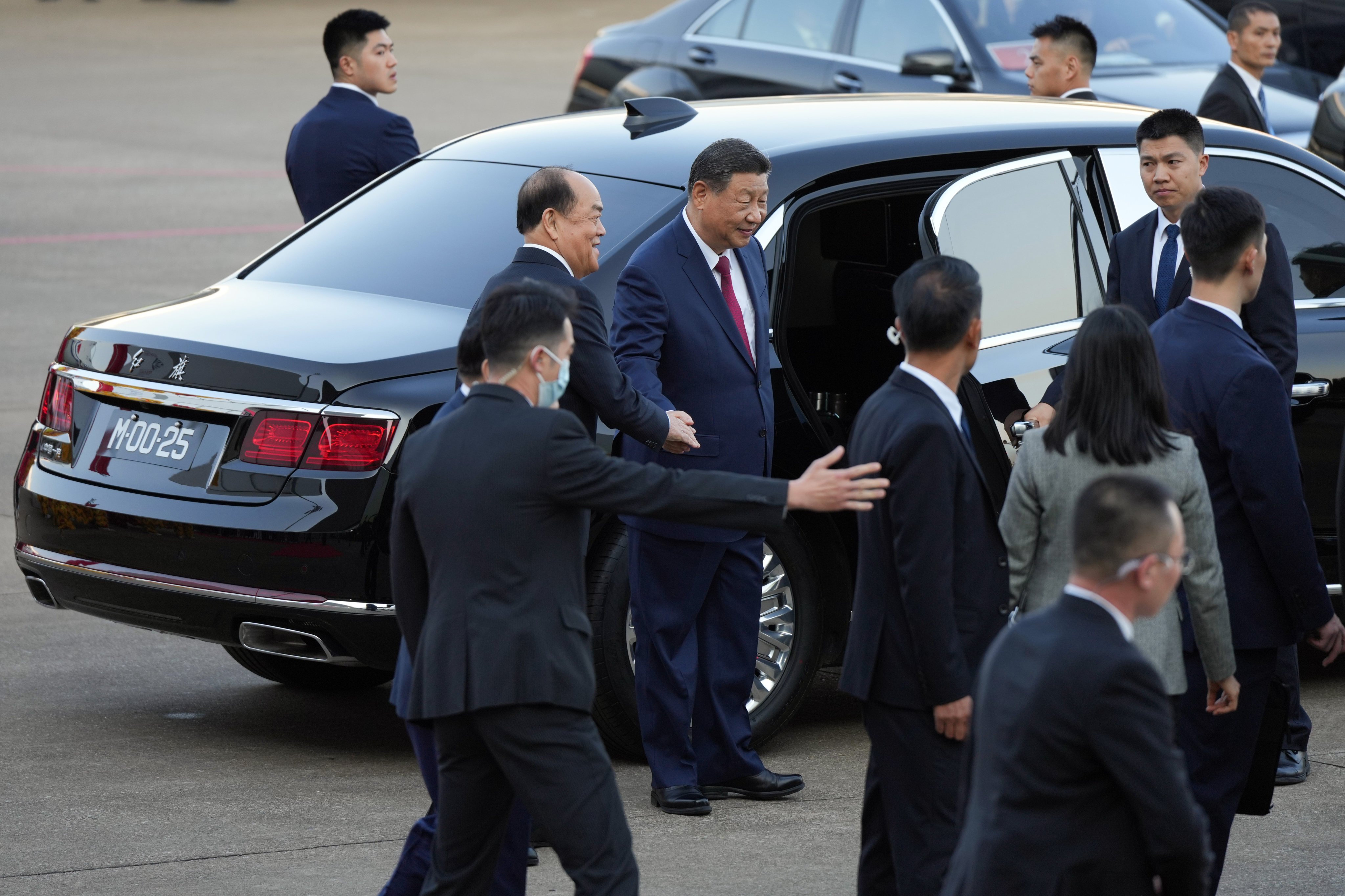 Chinese President Xi Jinping and Macau Chief Executive Ho Iat-seng shake hands at the city’s airport on Wednesday. Photo: Eugene Lee