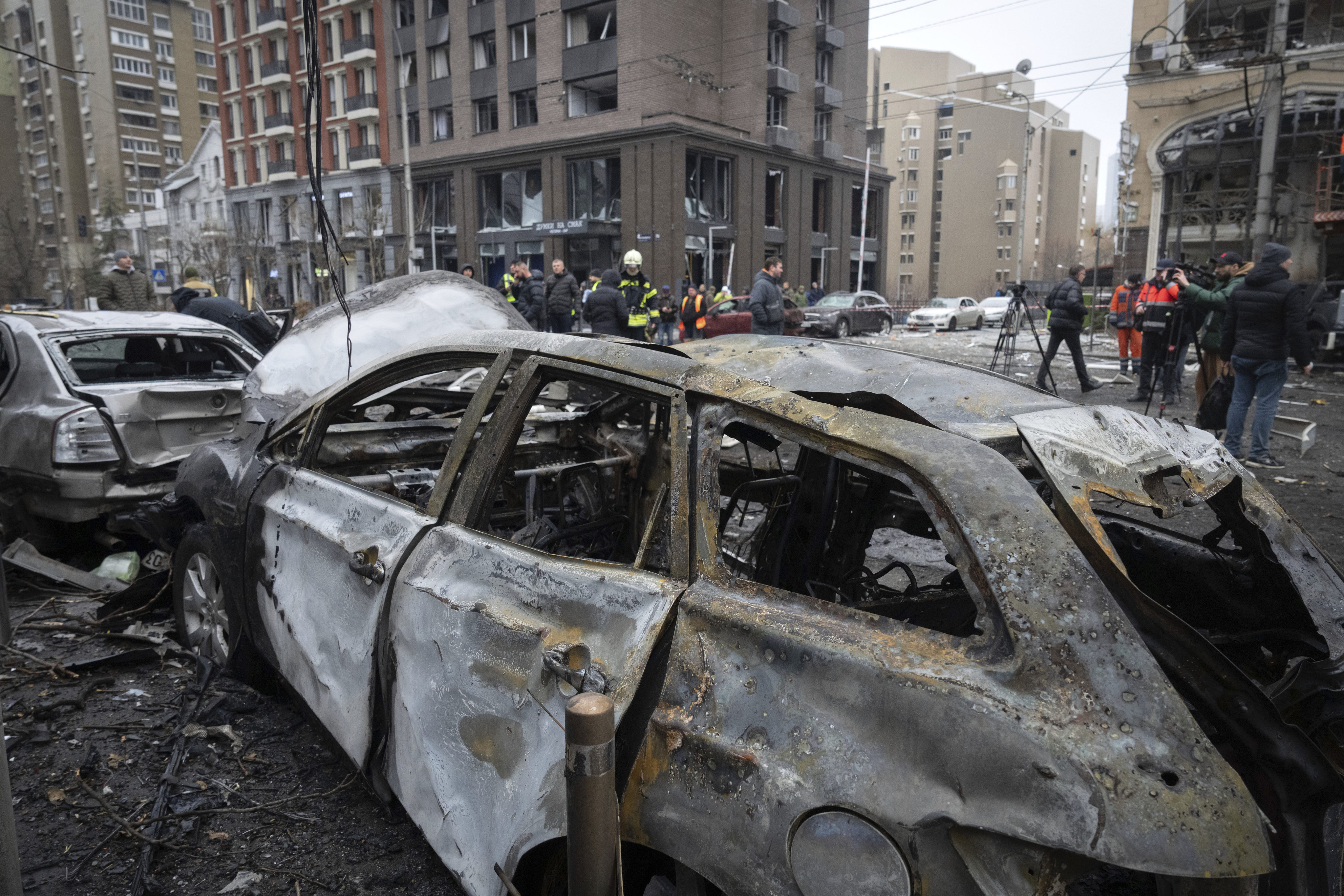 Cars are seen damaged on Friday after Russian attacks on Kyiv, Ukraine, in which at least one person was killed. Photo: AFP