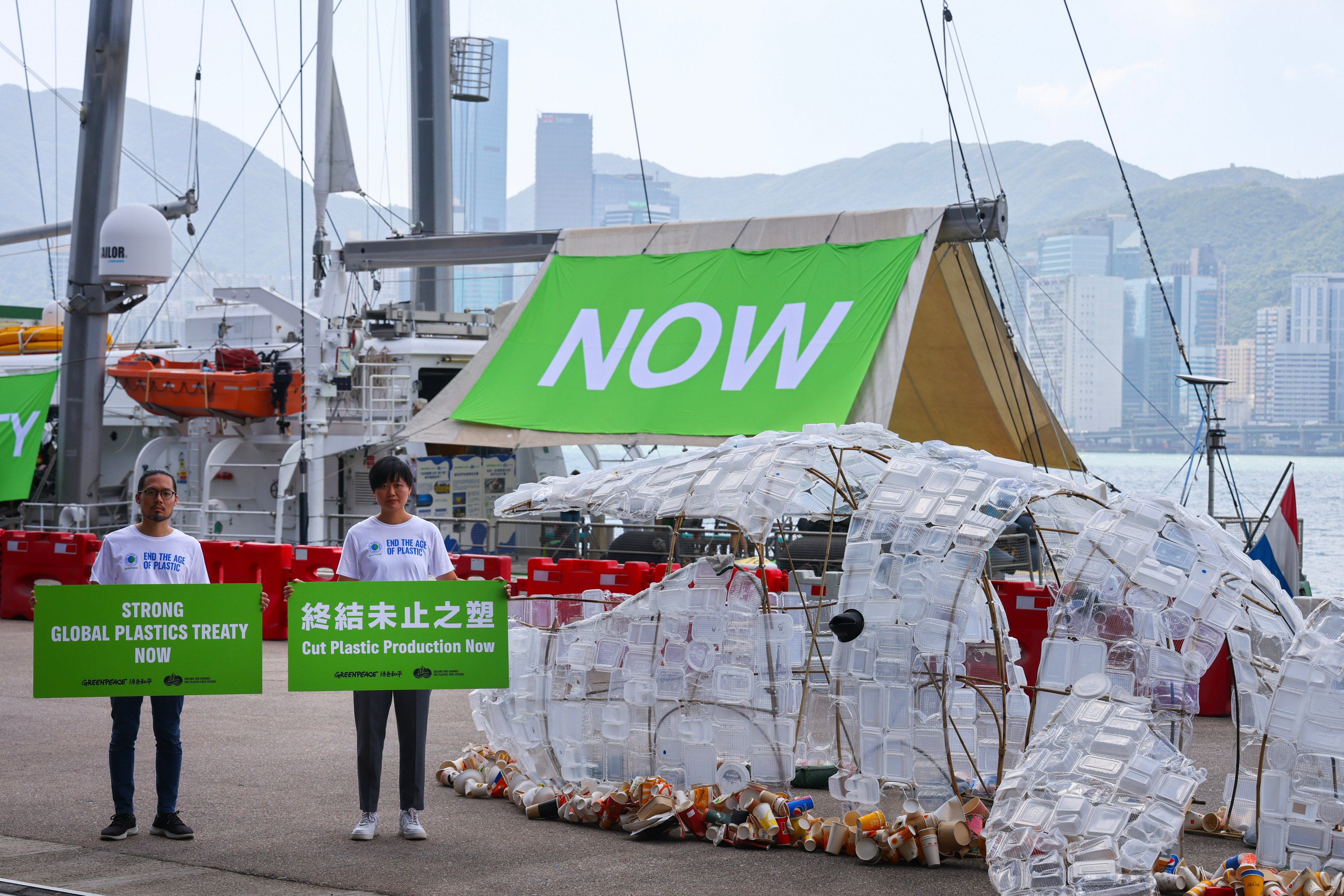 Greenpeace campaigners calling for a cut in plastic production at the Kai Tak Cruise Terminal on October 19. Its survey found that 97 per cent of the waste collected from two ecologically important riverbanks is plastic. Photo: Dickson Lee