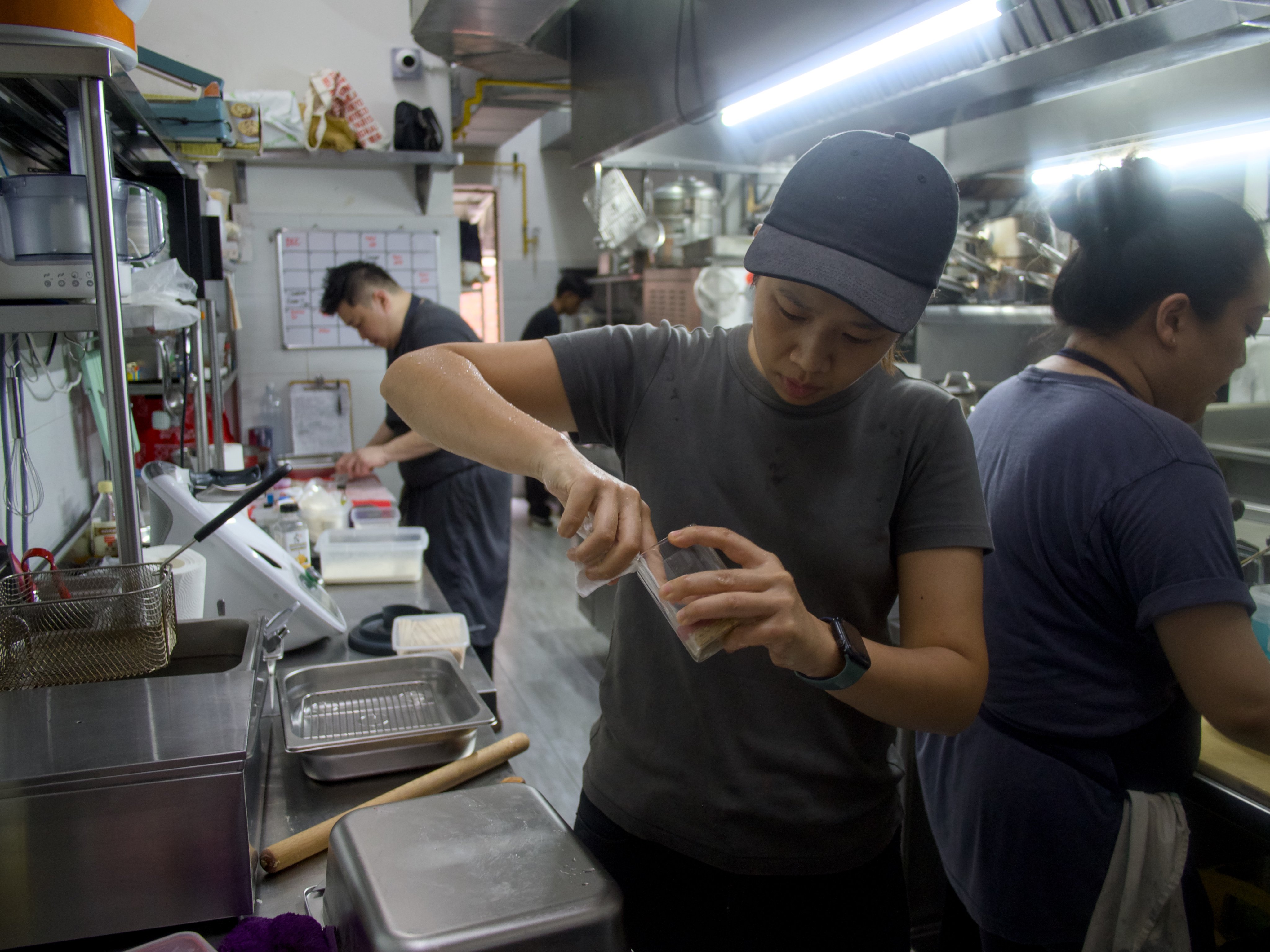 Chefs prepare their dishes before service at a monthly supper club in Kuala Lumpur. Photo: Hadi Azmi