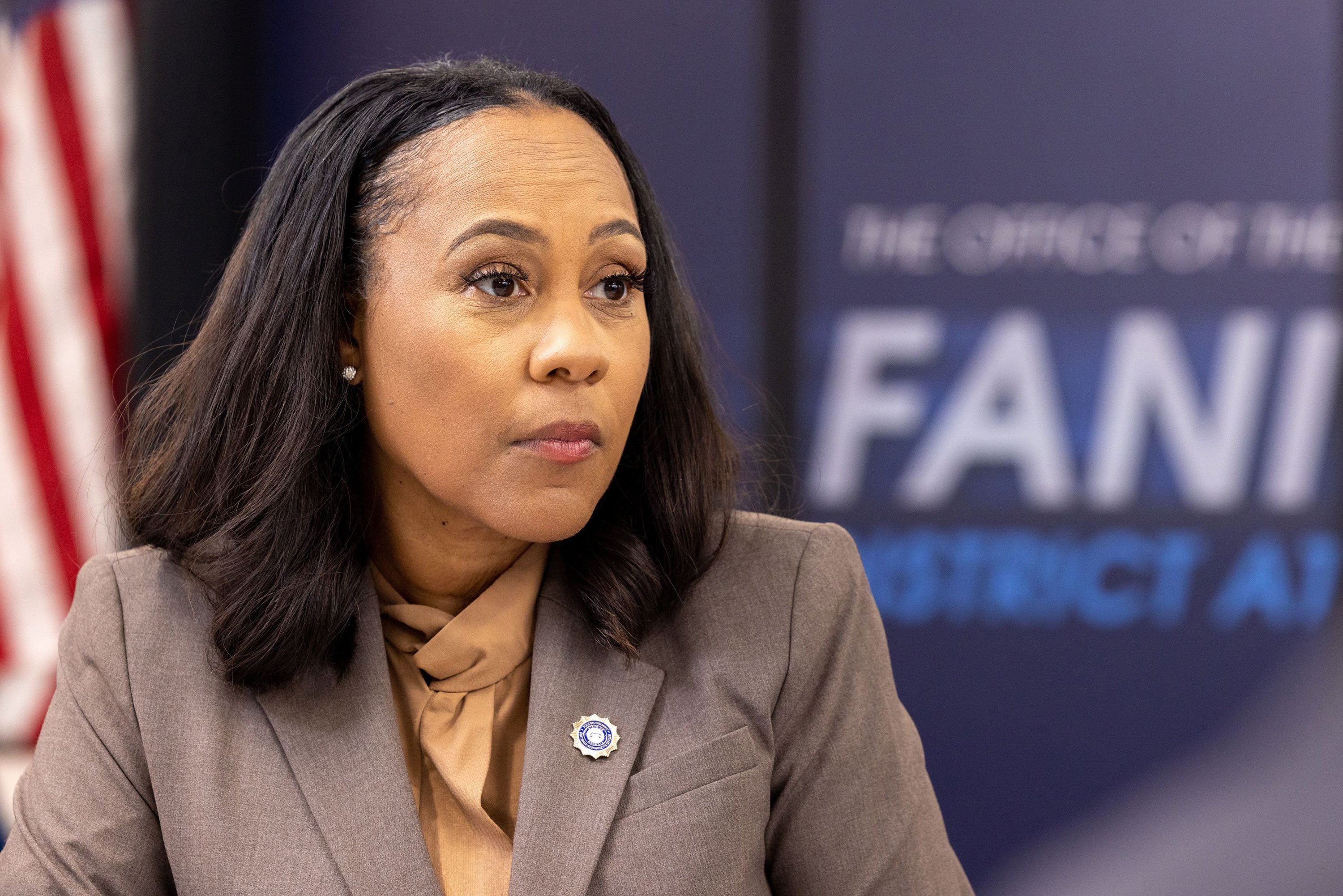 Fulton County District Attorney Fani Willis listens during a press interview in Atlanta in July. Photo: TNS