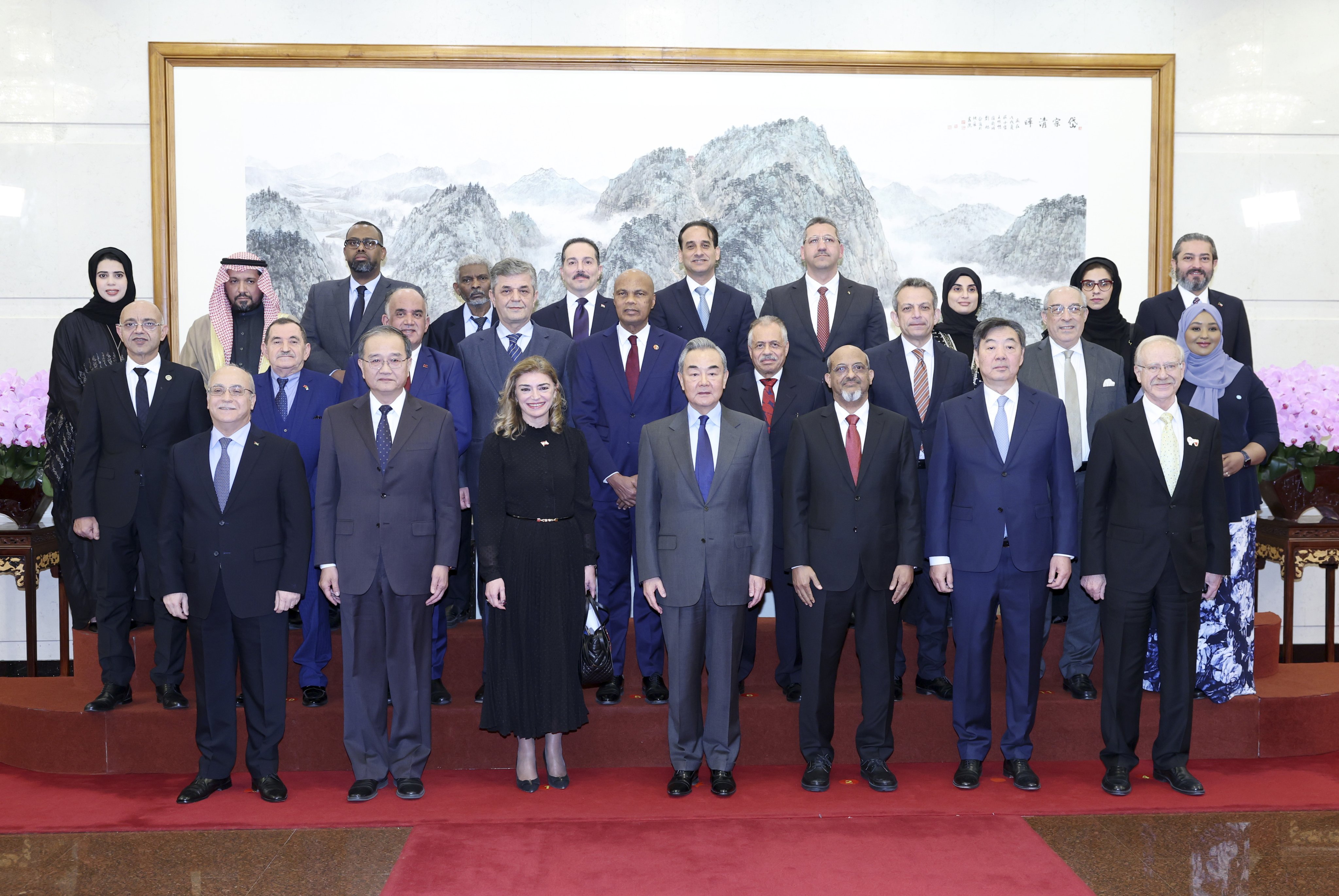 Chinese Foreign Minister Wang Yi (front row, centre) with diplomats from several Arab nations in Beijing on Thursday. Photo: EPA-EFE 