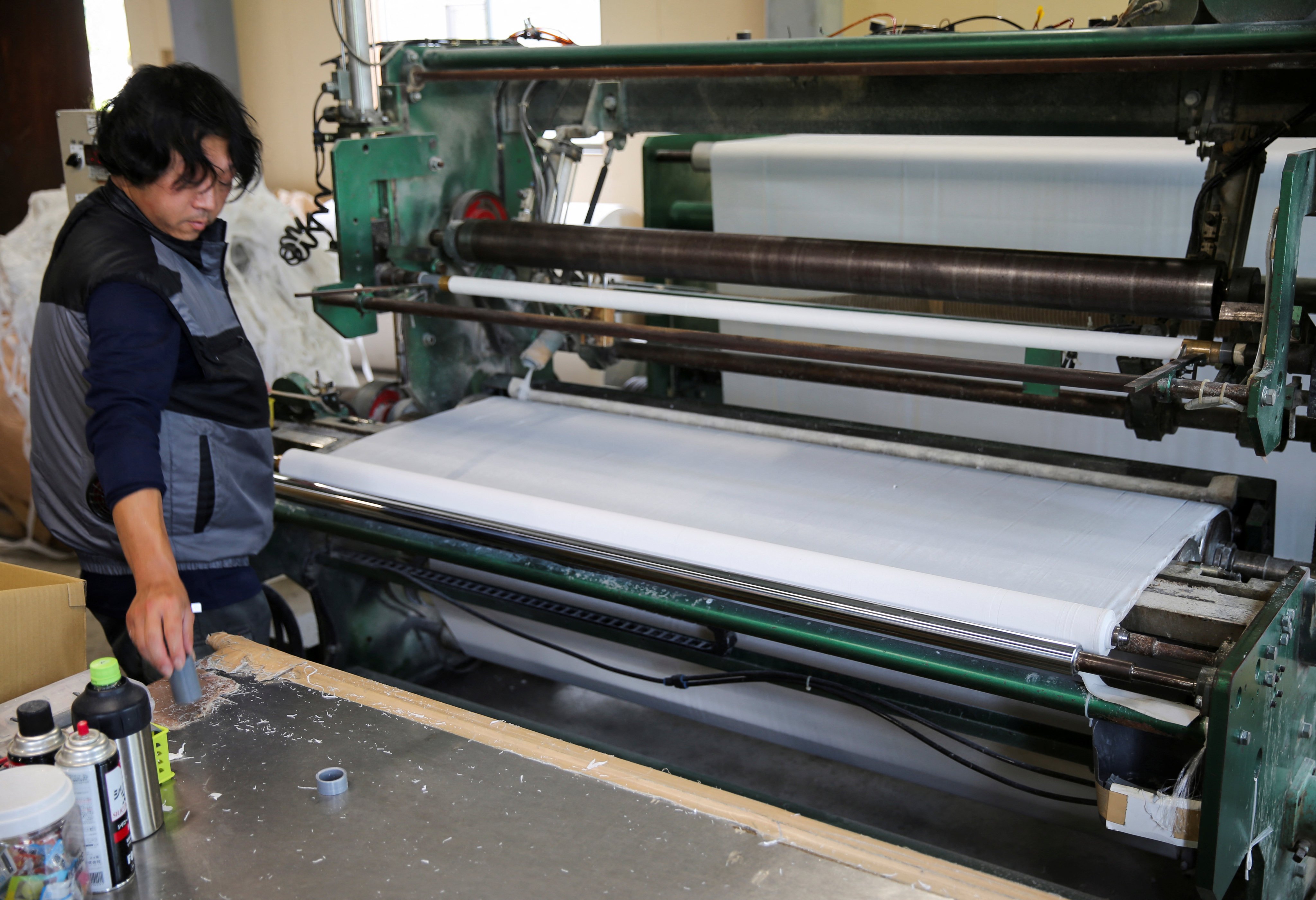 A worker prepares rolls of toilet paper at the Maruhide Seishi factory in Ino, Japan’s Kochi prefecture. Photo: Reuters