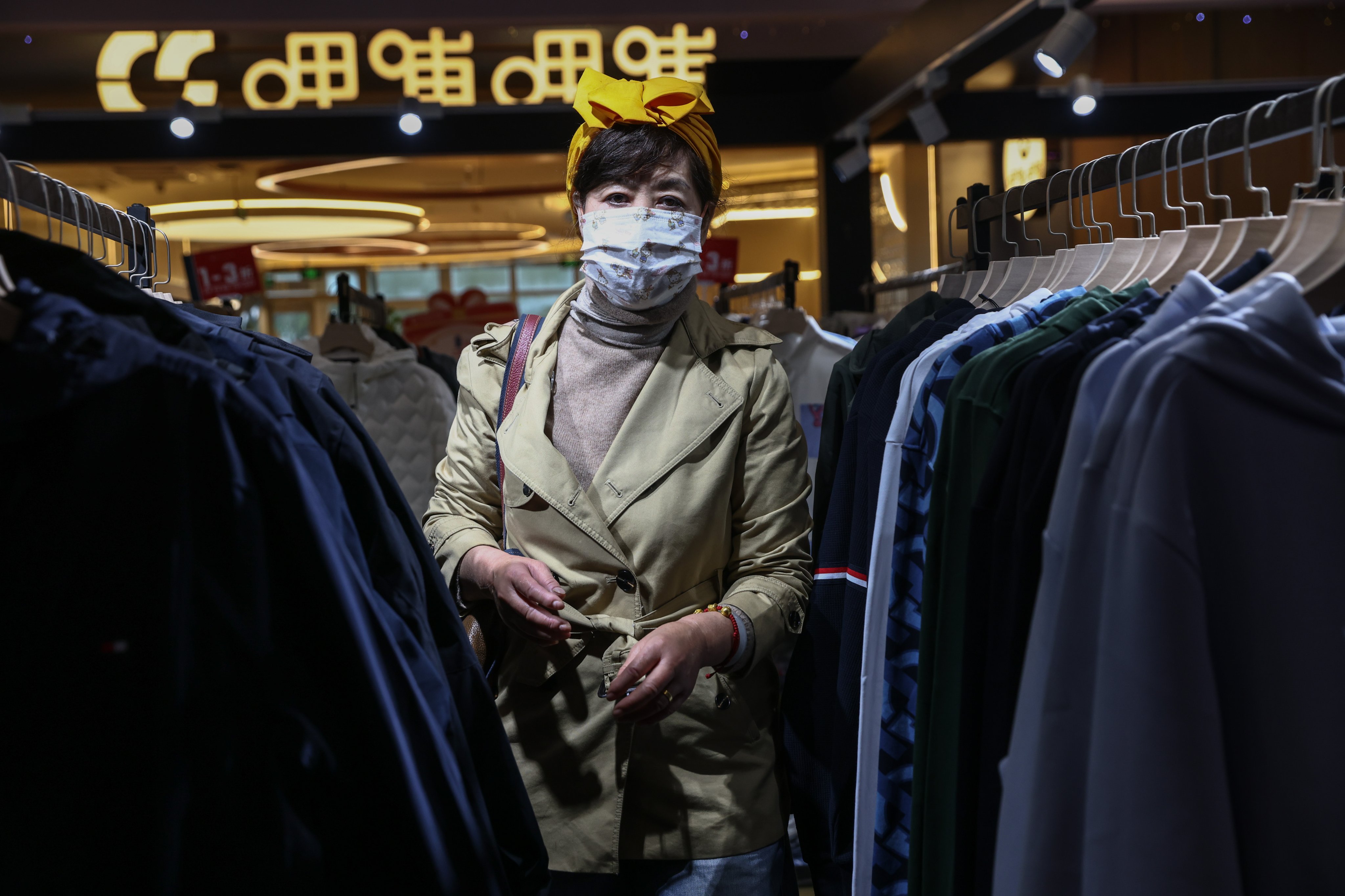 A woman shops at a clothing store in Beijing, China, on October 18. Photo: EPA-EFE