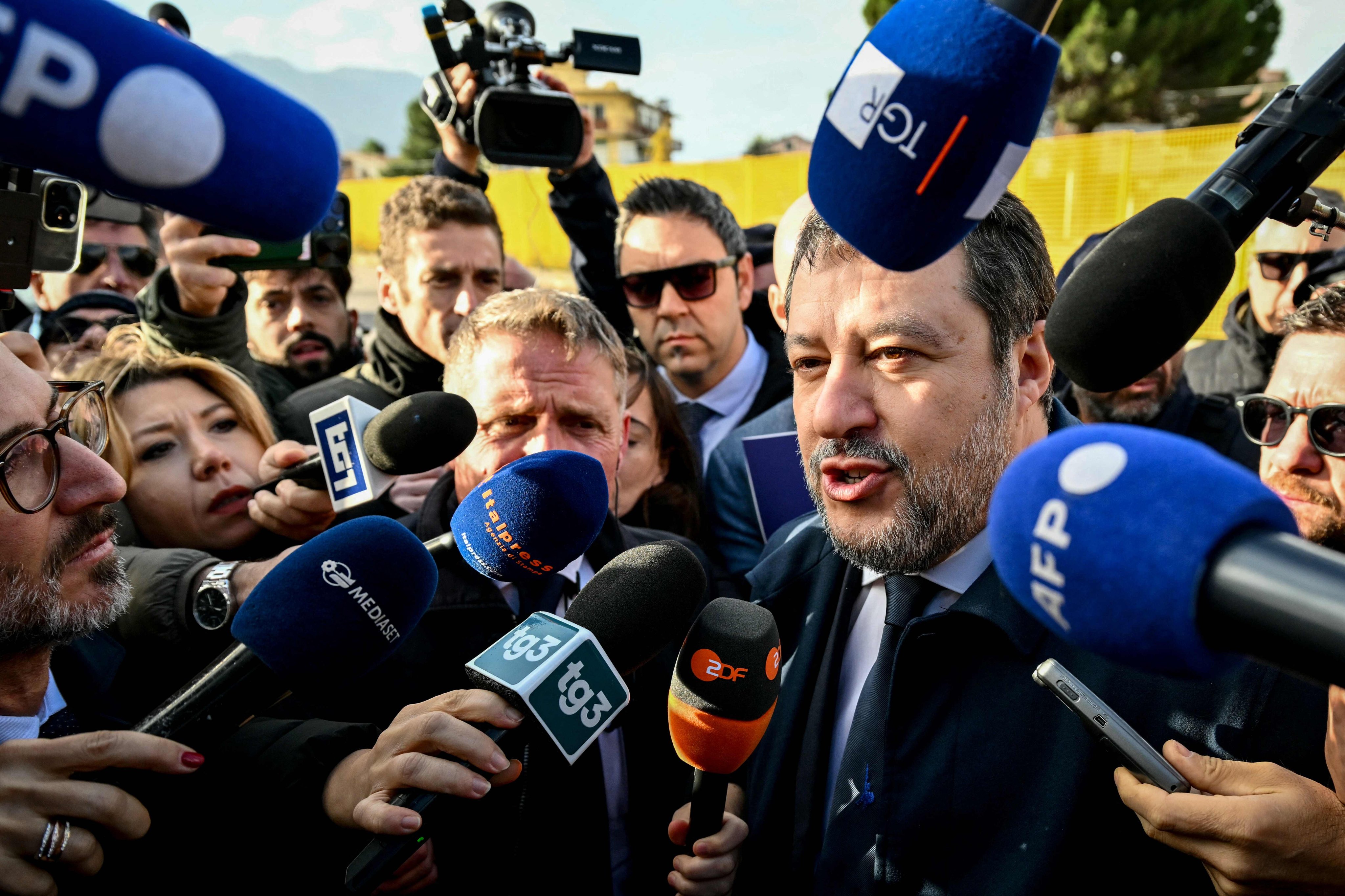 Italy’s deputy PM Matteo Salvini talks to the press as he arrives at the Bunker Courtroom in Palermo, Sicily, on Friday. Photo: AFP