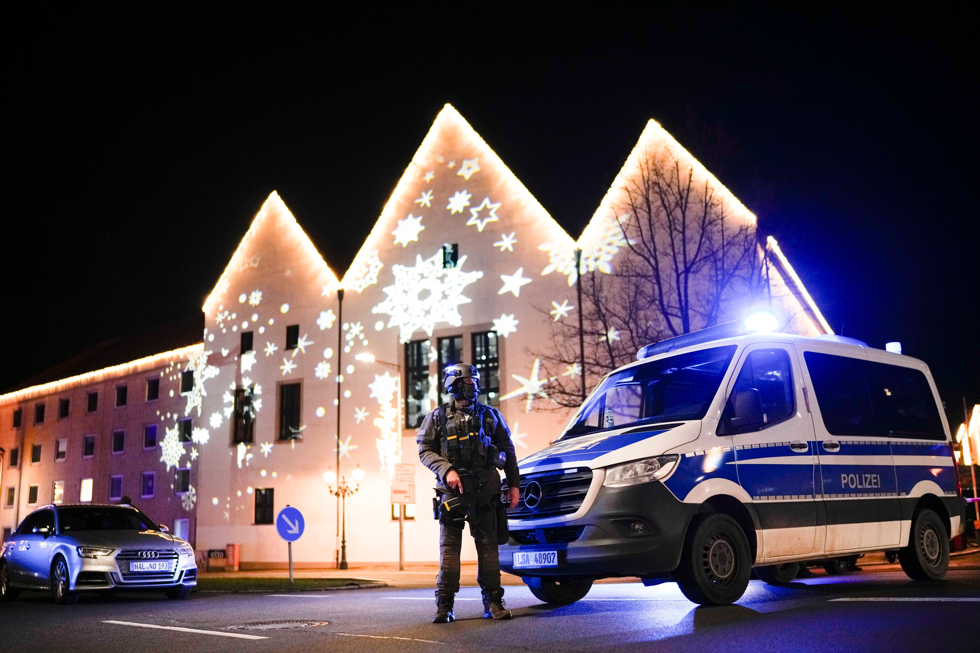 A police officer guards a blocked road near a Christmas market after an incident in Magdeburg, Germany, on Friday. Photo: AP