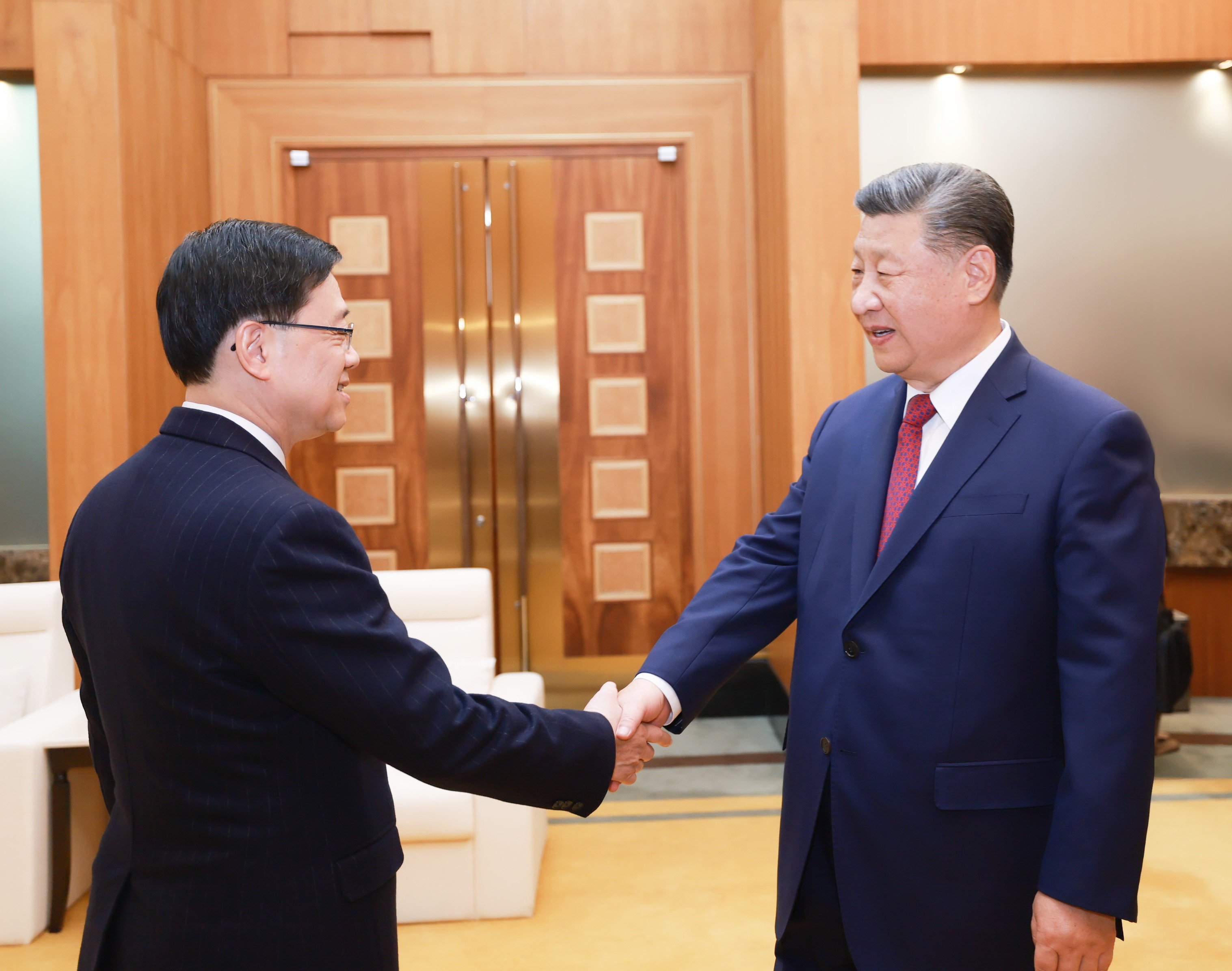 Hong Kong leader John Lee (left) and Chinese President Xi Jinping meet on Thursday. Photo: Xinhua 