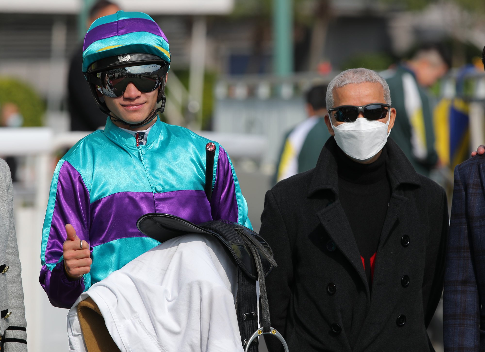 Jockey Jerry Chau and trainer Benno Yung celebrate Another World’s win.