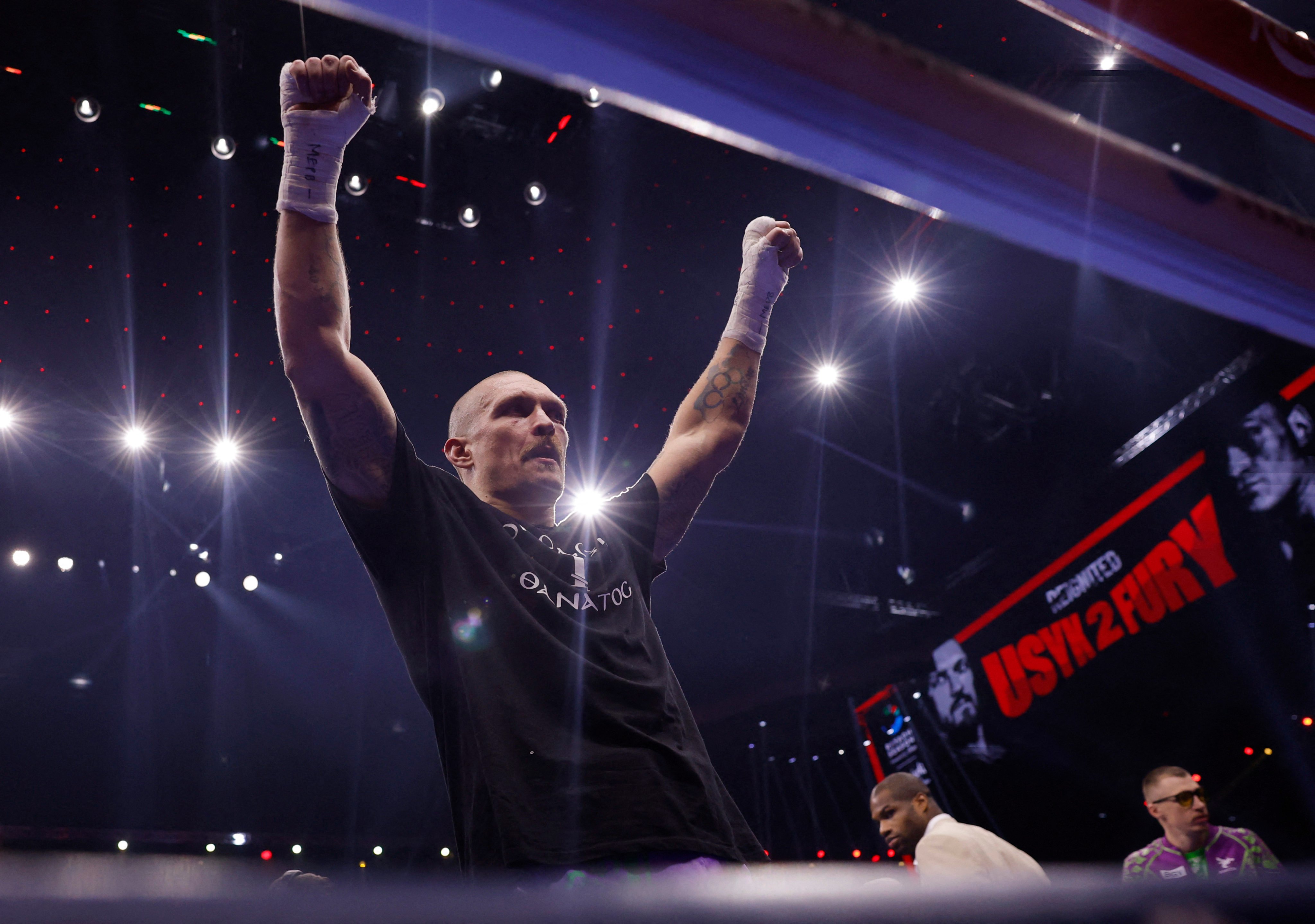 Oleksandr Usyk celebrates after beating Tyson Fury for the second time. Photo: Reuters