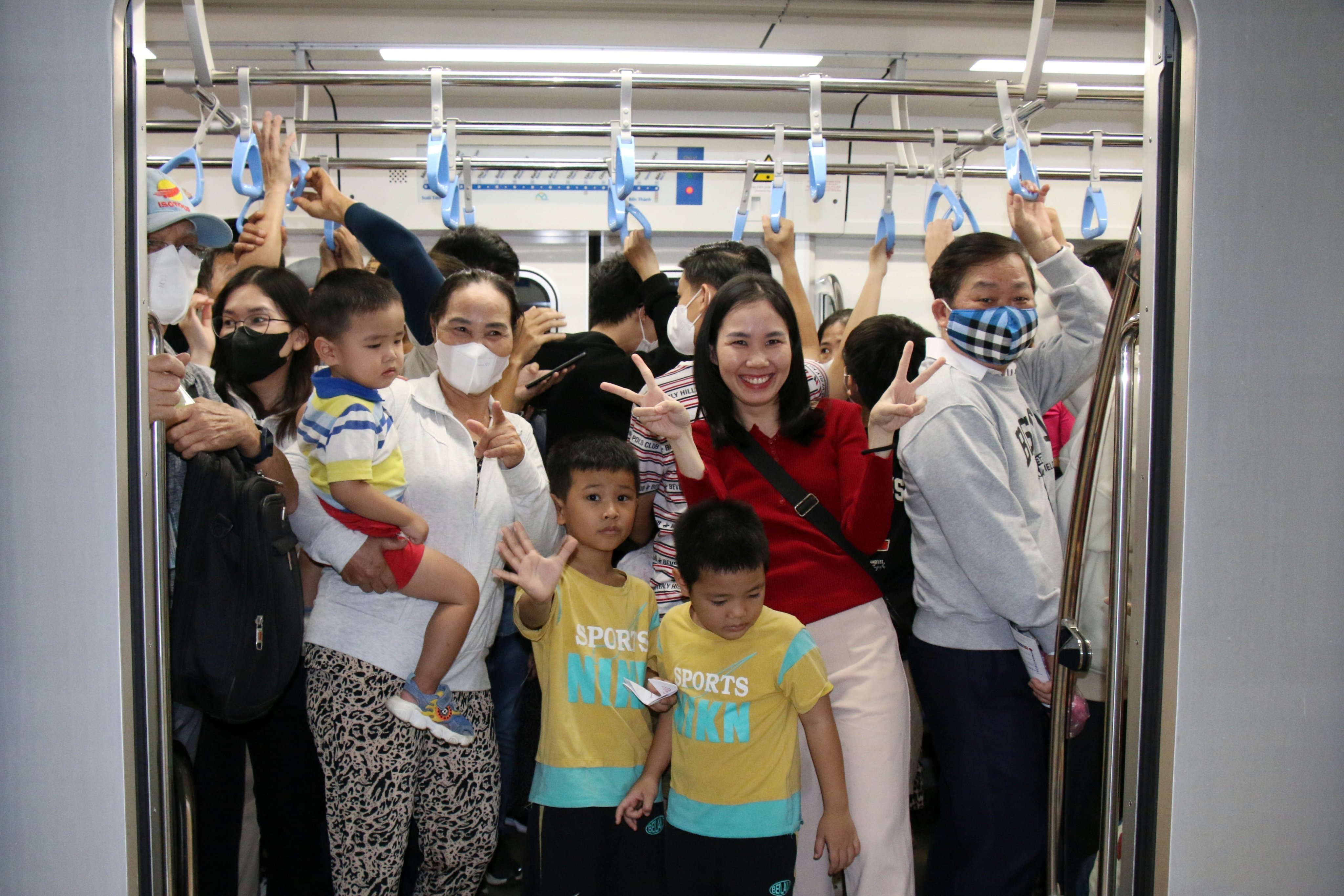 People take a train in Ho Chi Minh. Photo: Vietnam News Agency via EPA-EFE 