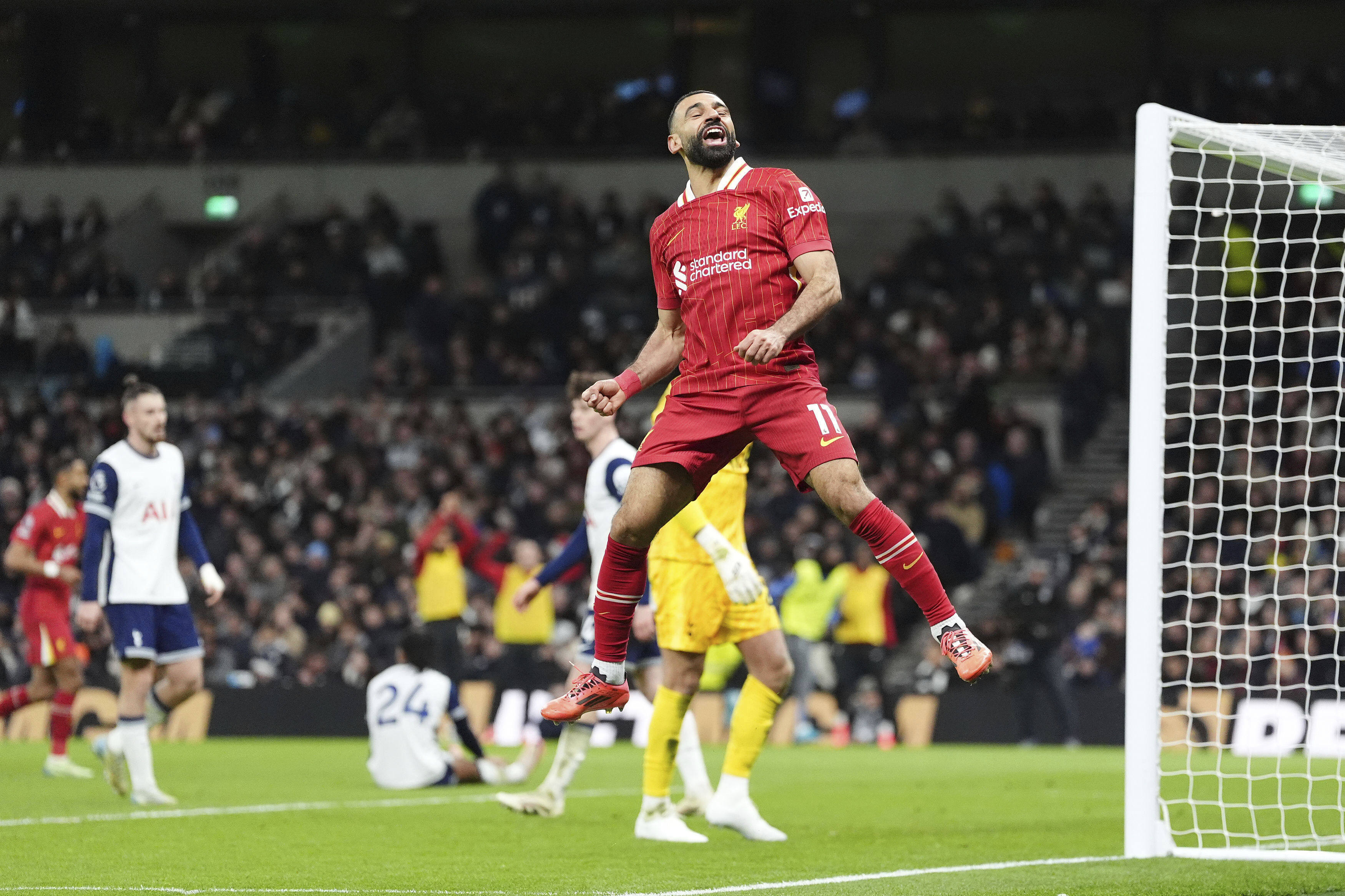 Mohamed Salah celebrates scoring Liverpool’s fifth against Tottenham. Photo: AP