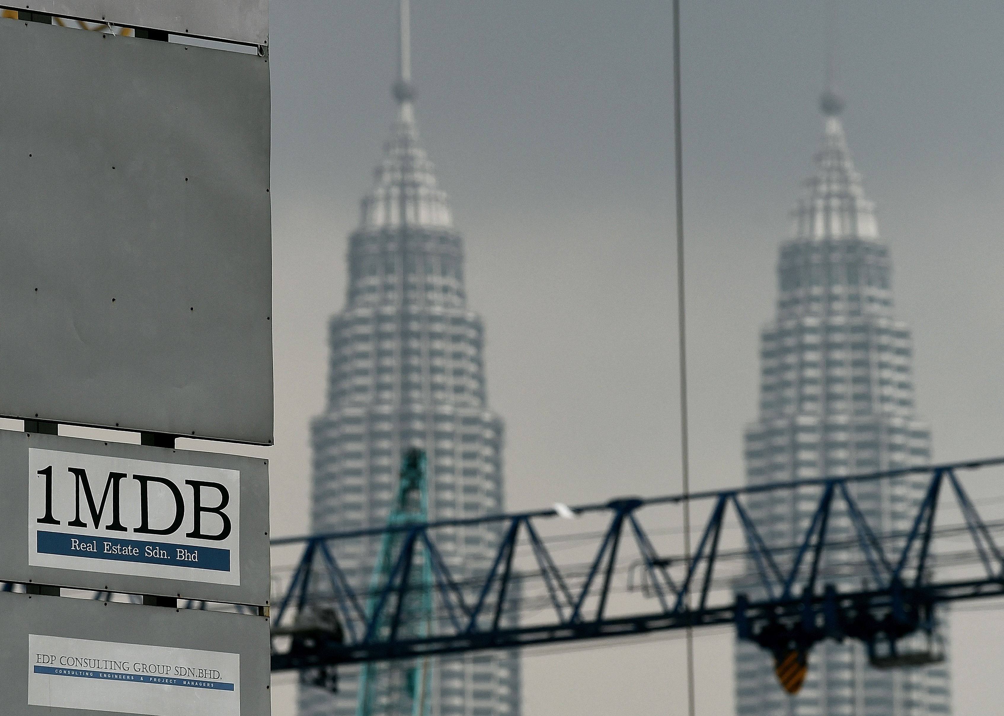 The 1MDB logo is seen on a billboard at the funds flagship Tun Razak Exchange under-development site in Kuala Lumpur. Photo: AFP