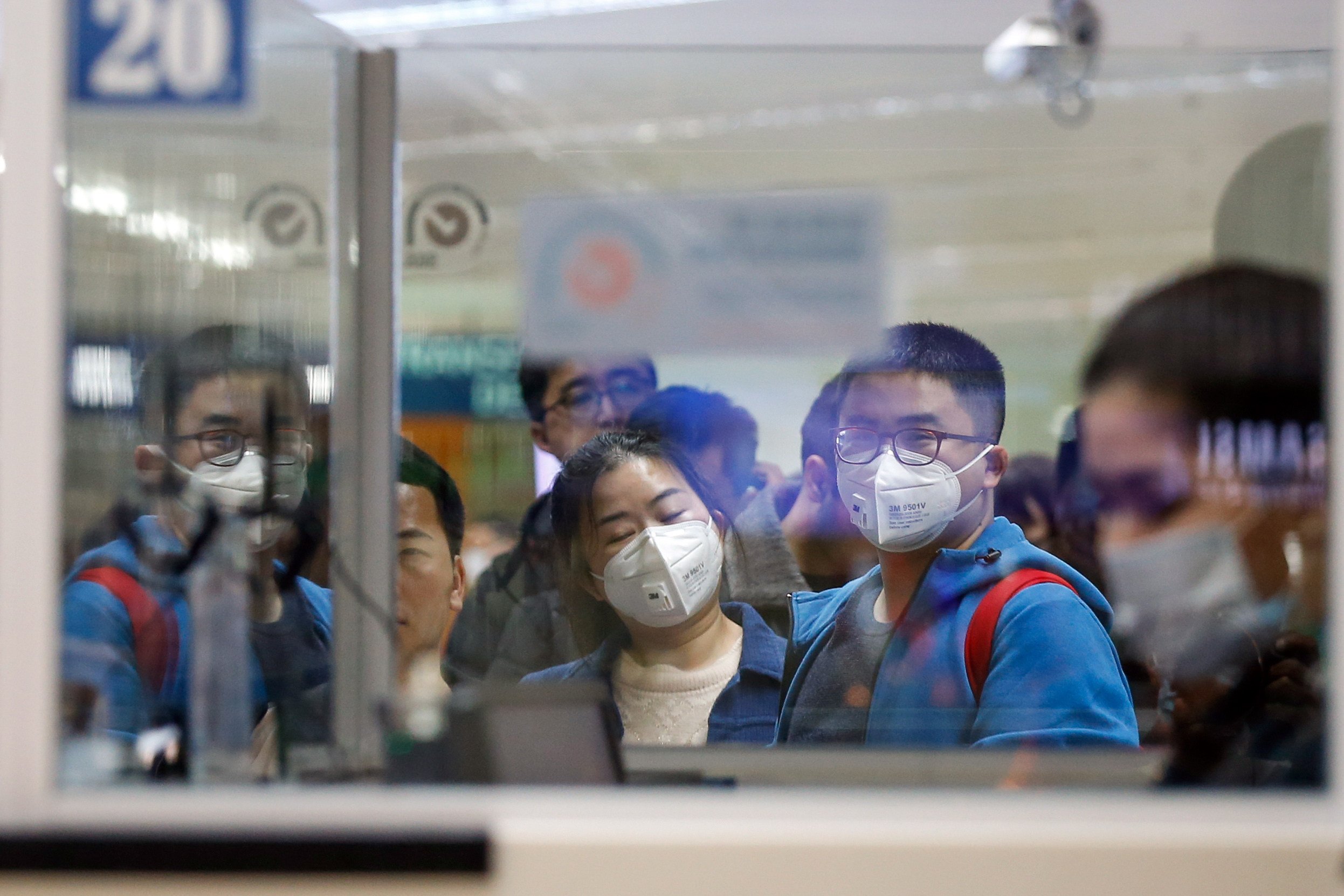 Passengers from Guangzhou, China line up for immigration at the Ninoy Aquino International Airport in Manila, the Philippines. Photo: EPA-EFE