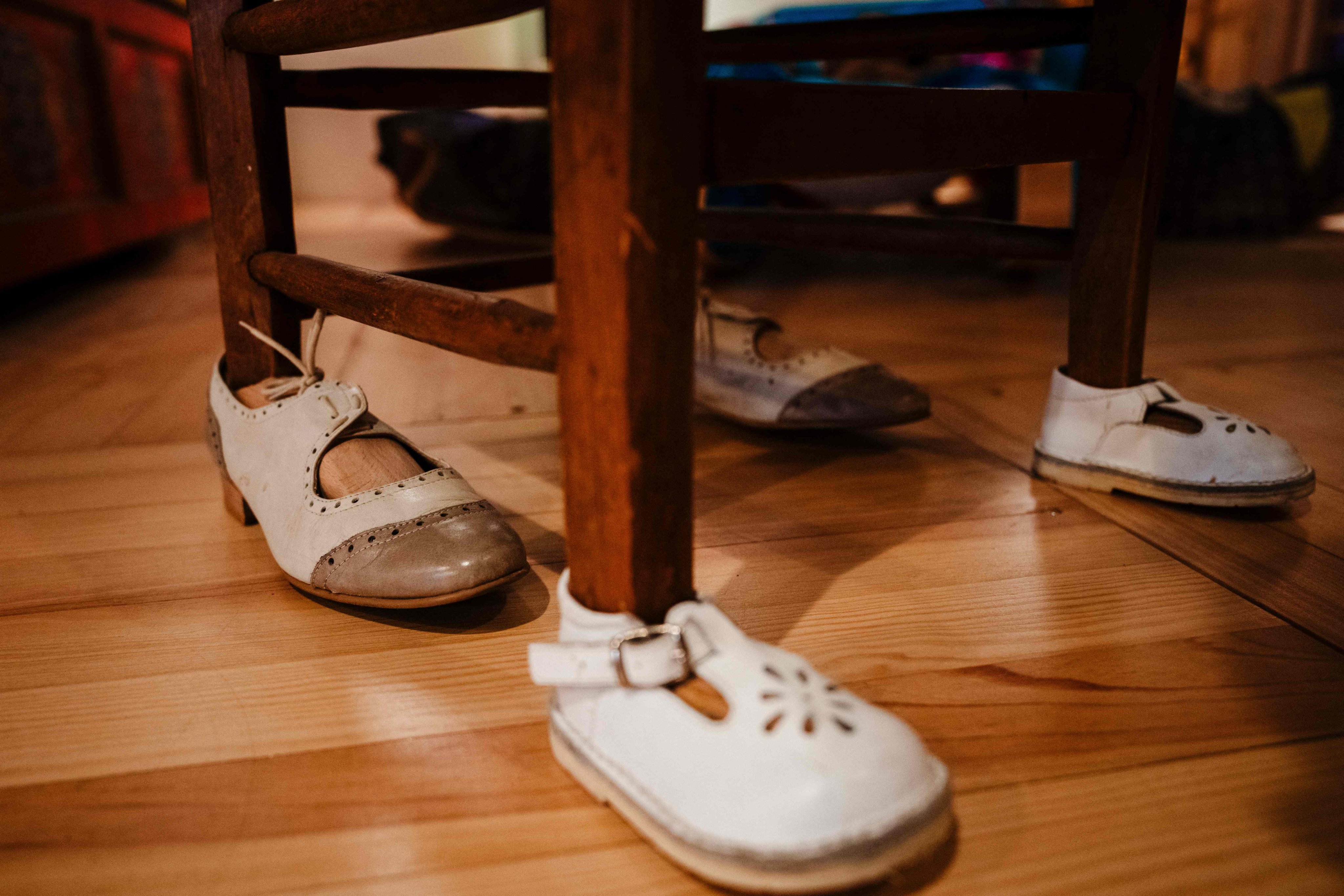 This photograph shows vintage children’s shoes worn on the legs of a chair at the Cite des Bebes at the Cite des Science et de l’industrie (City of Science and Industry) in Paris, France. Photo: AFP