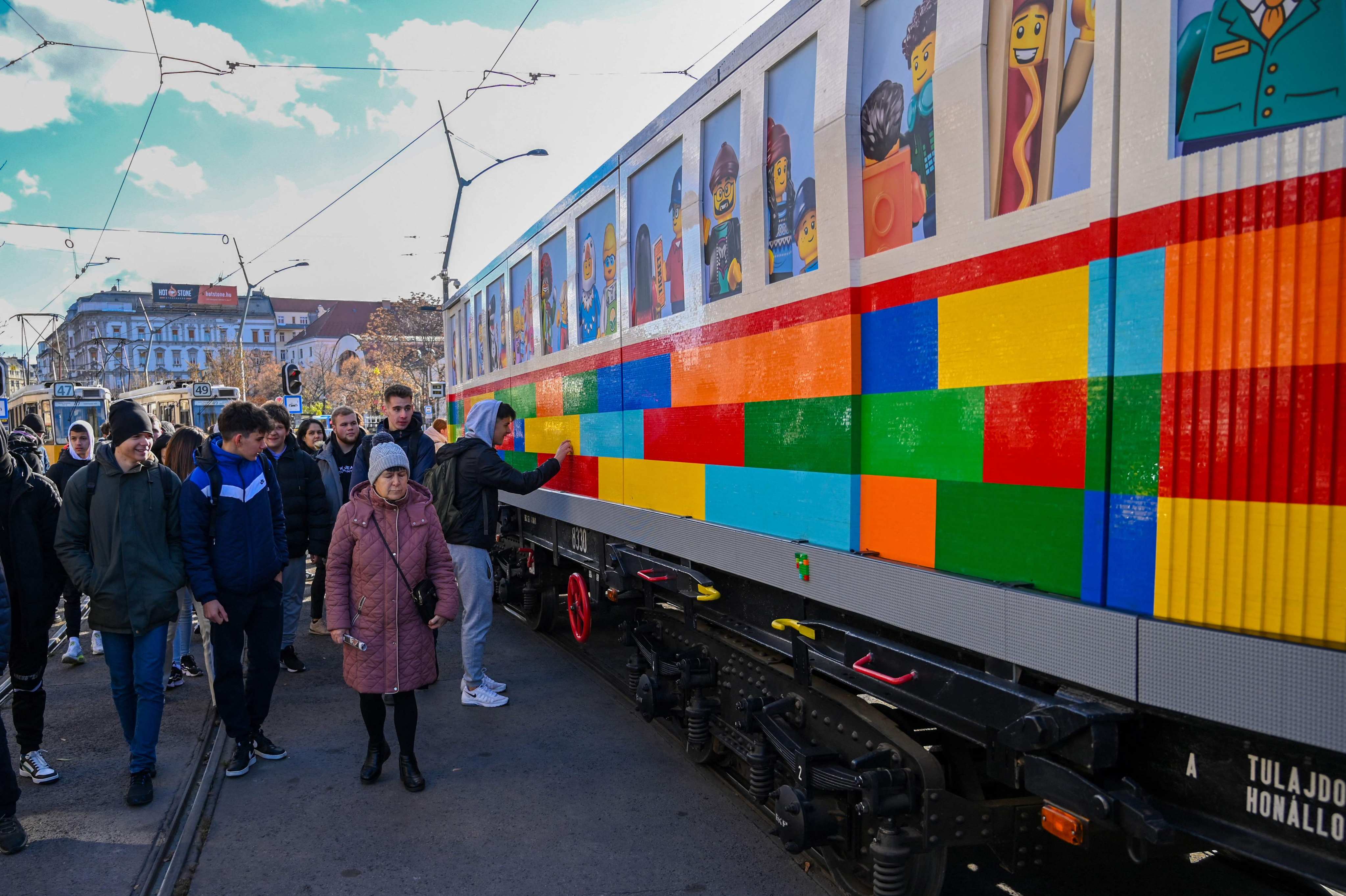 Visitors look at a full-size tram built from Lego bricks by Hungarian artist Balazs Doczy in Deak Ferenc Square in downtown Budapest on November 21, 2024. Photo: AFP