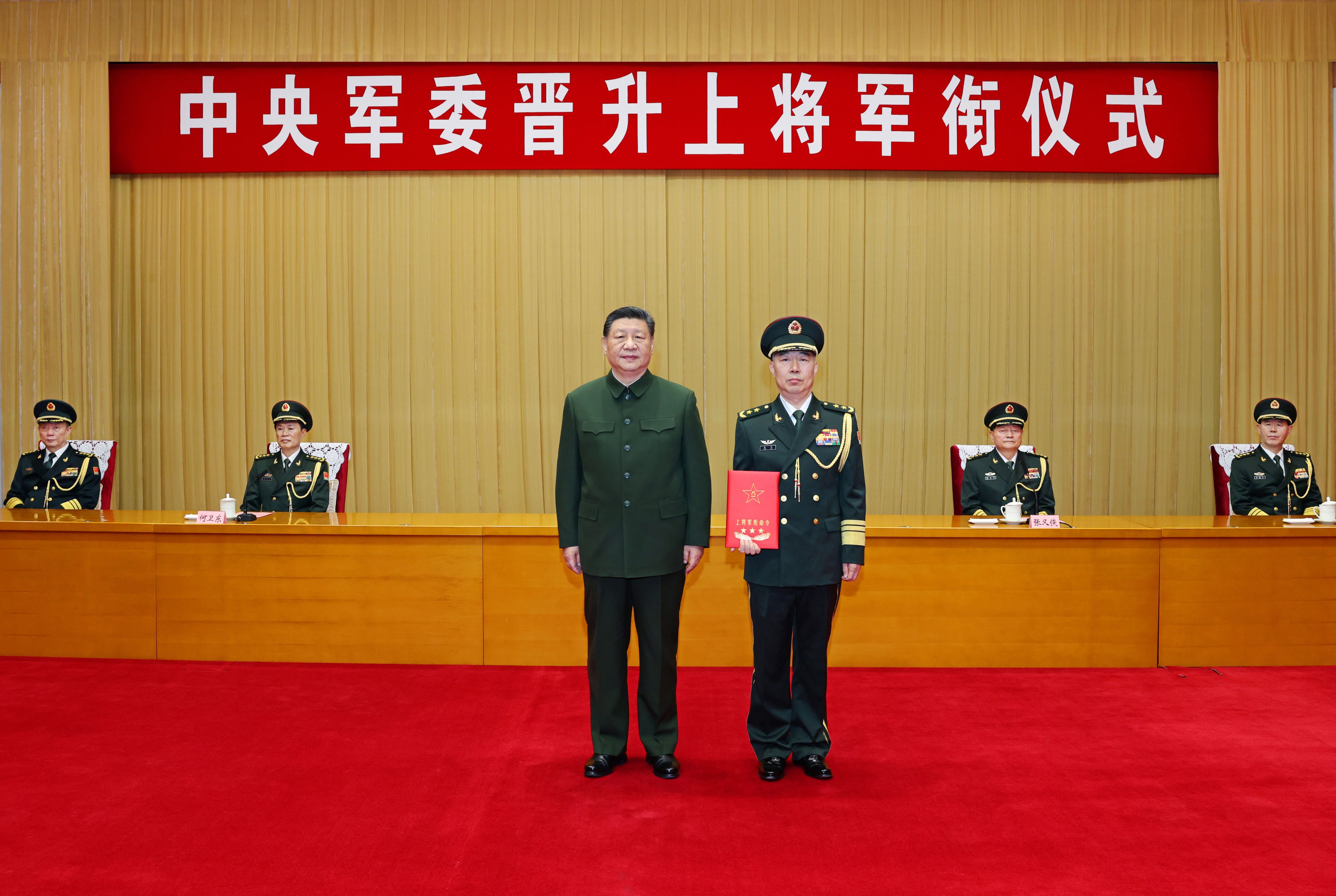 Chinese President Xi Jinping (left), also chairman of the Central Military Commission , presents a certificate to Chen Hui at a promotion ceremony in Beijing on Monday. Photo: Xinhua